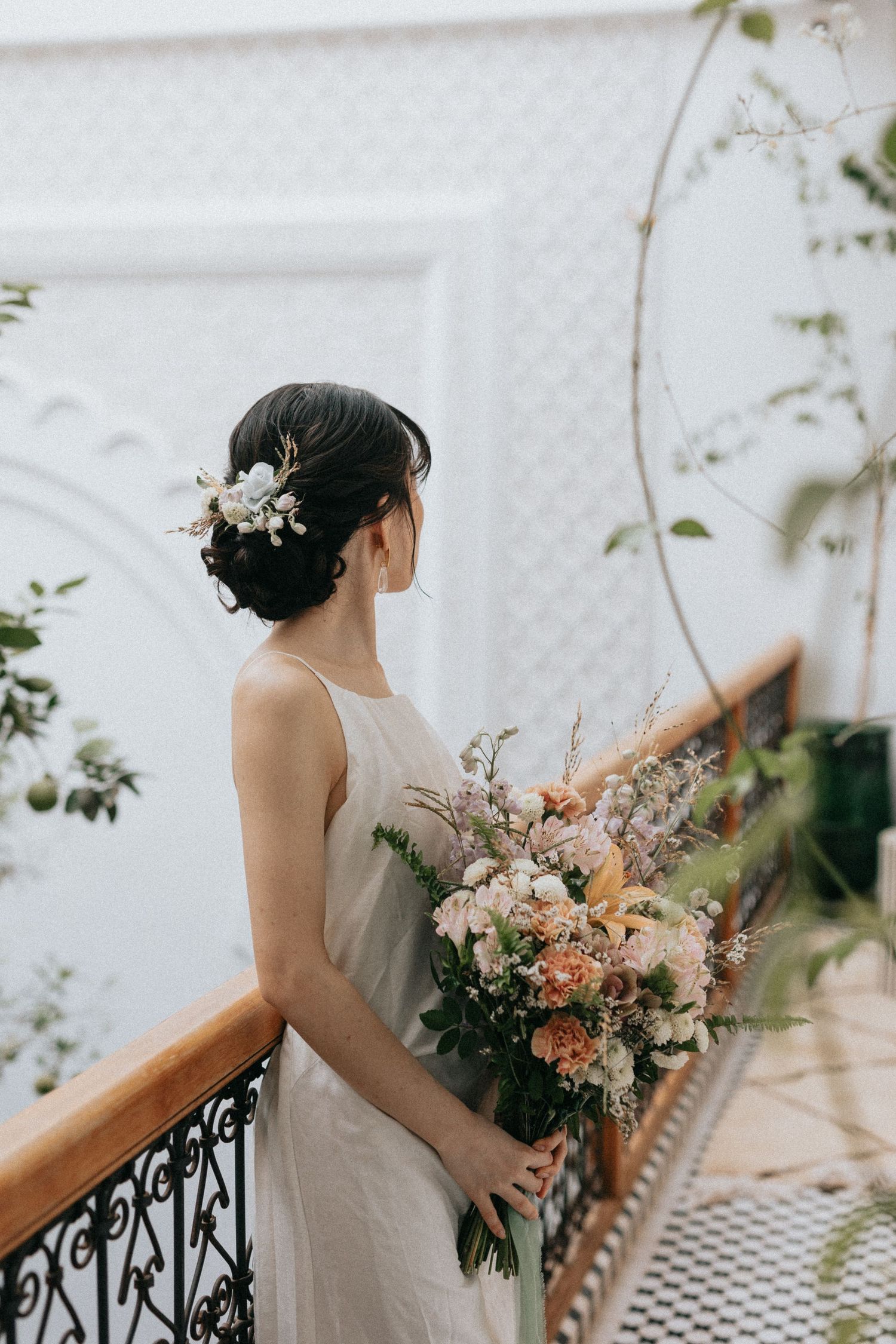 Soft-lit bridal portrait in a luxury riad with floral styling
