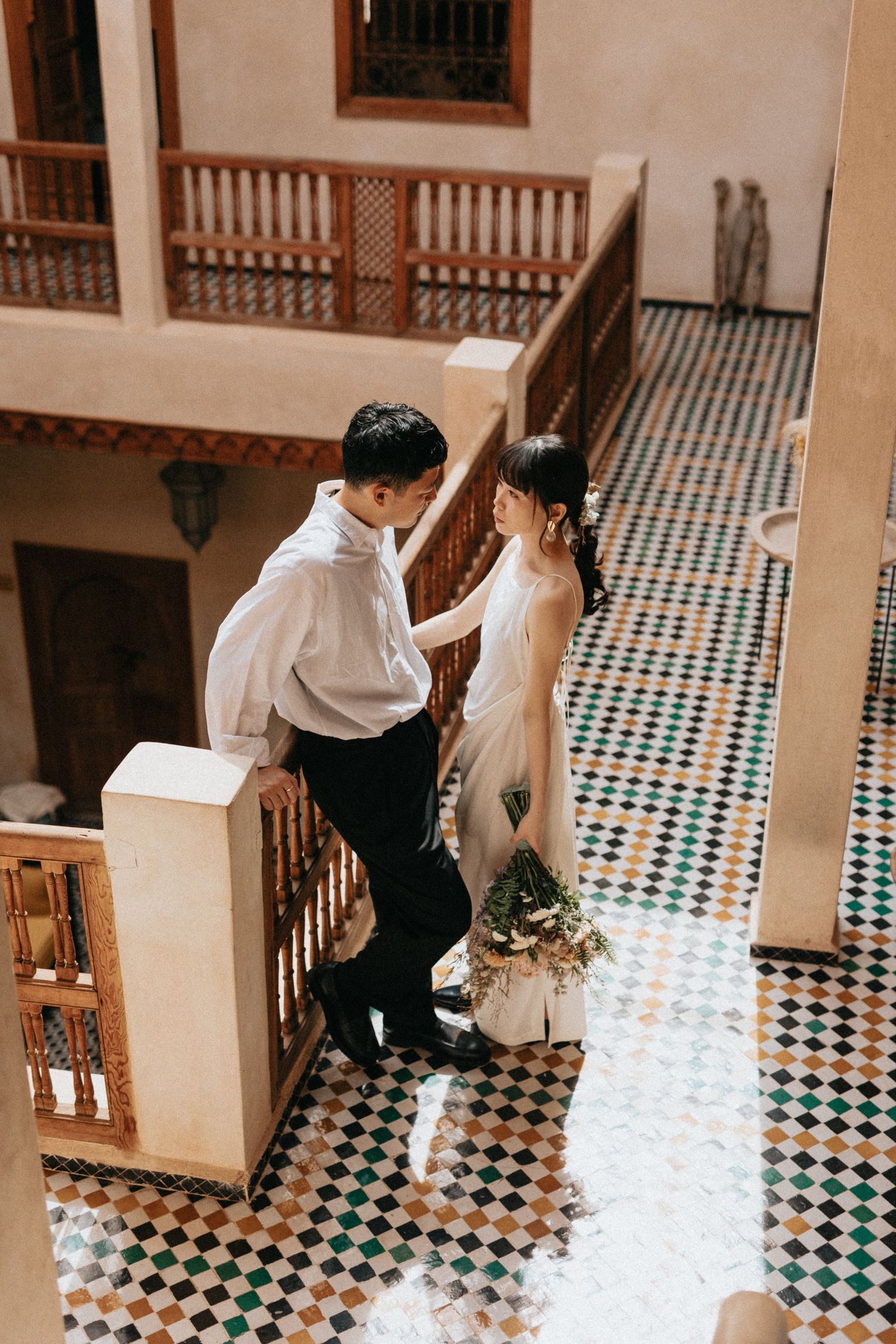 Romantic couple portrait in a Marrakech riad courtyard