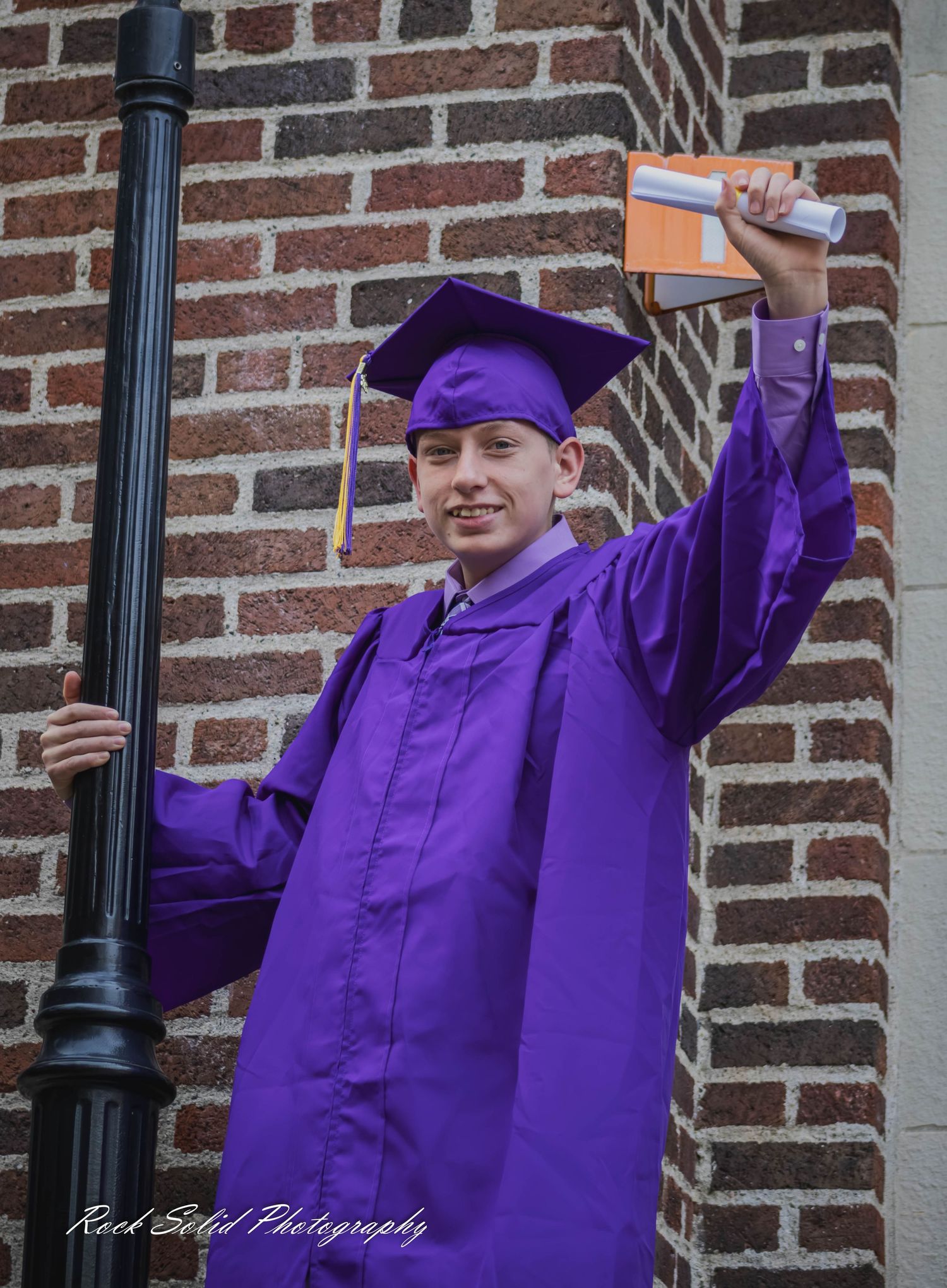 View high-quality Bay City Central High graduate. Browse professional cap & gown portraits and outdoor senior photos in Bay City, Mi.