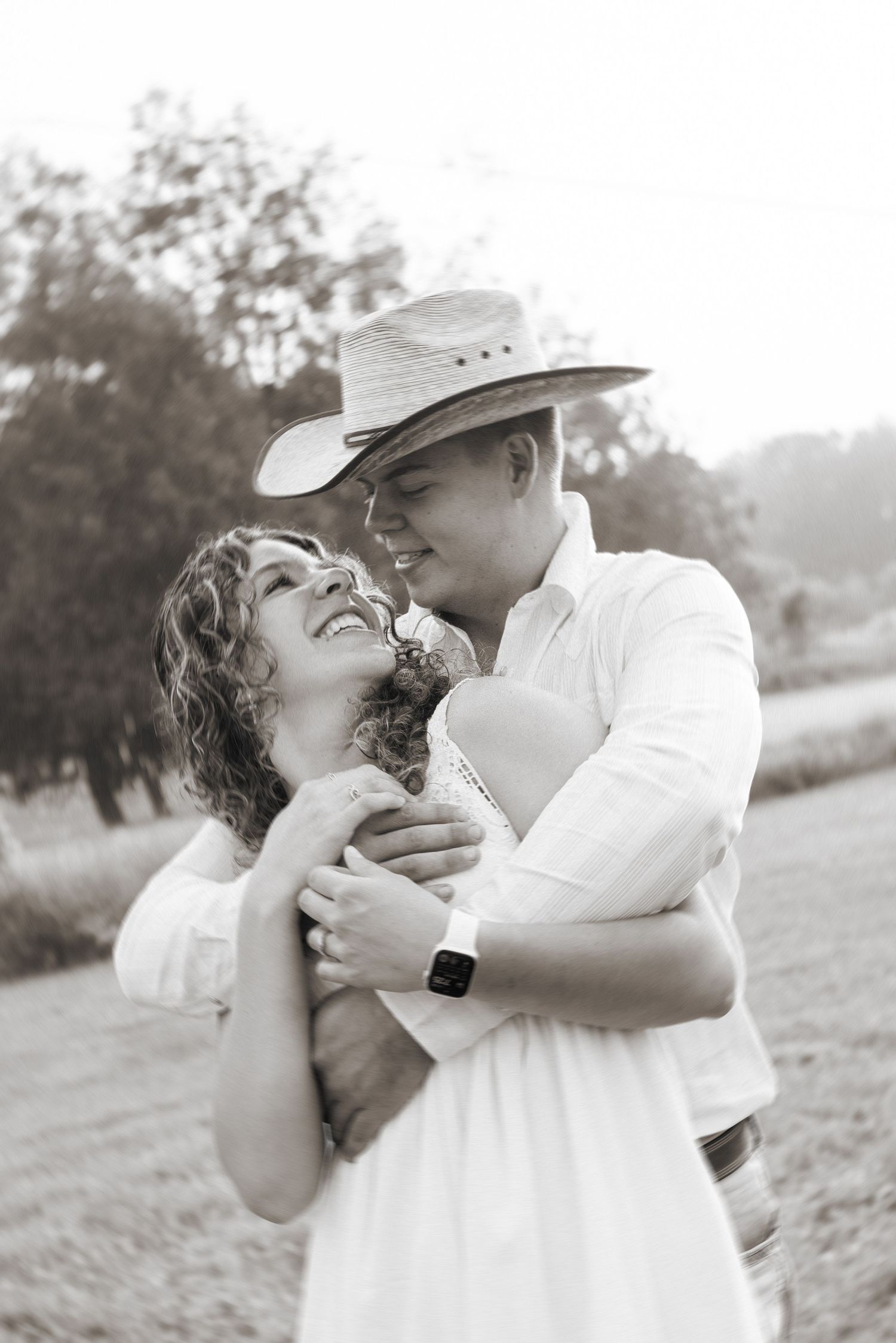 A romantic couple's photoshoot showing tender moments in black and white.