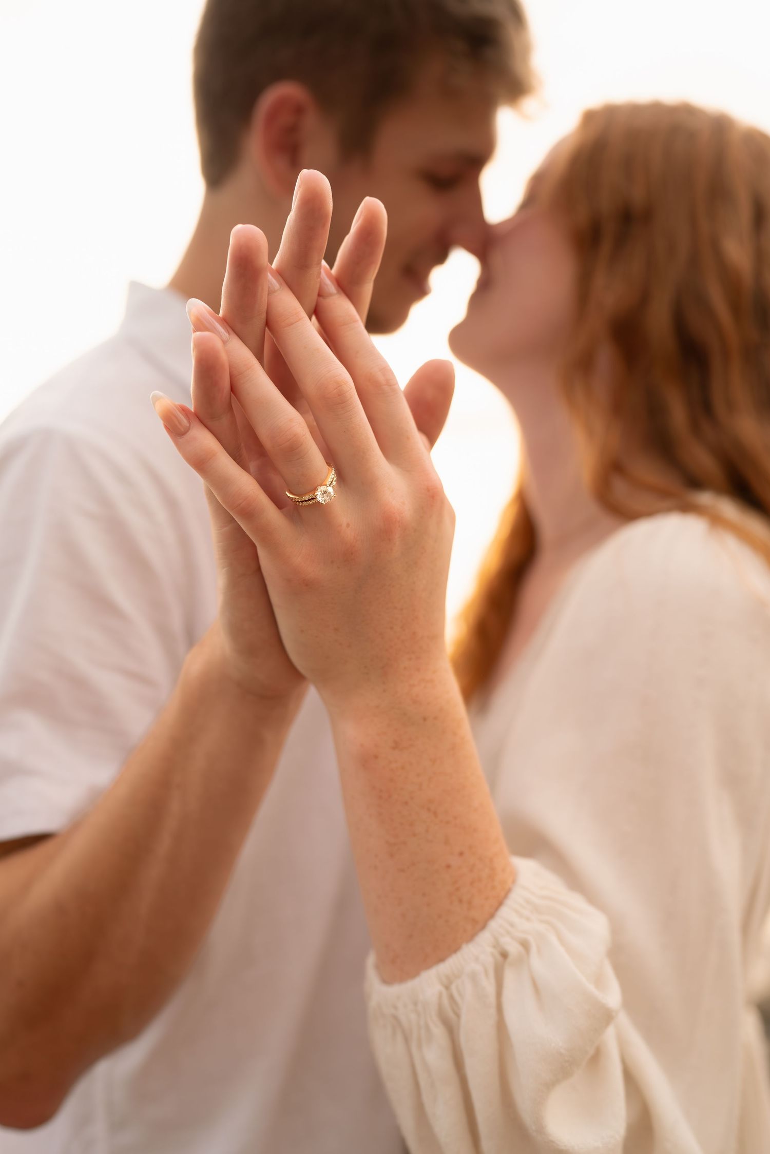 Close-up shots of hands in white clothing against bright background.