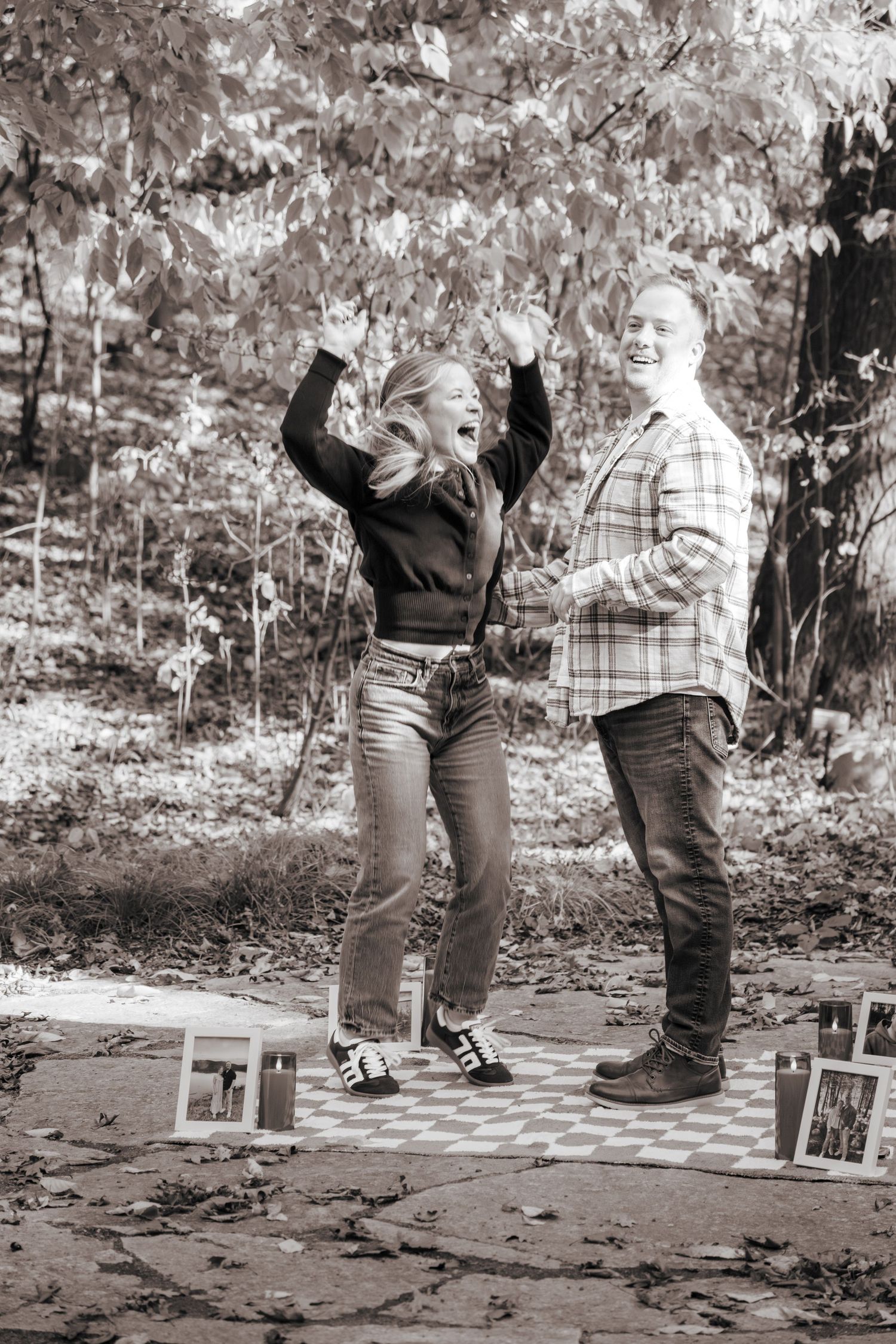A black and white sequence capturing a joyful reaction to a marriage proposal.
