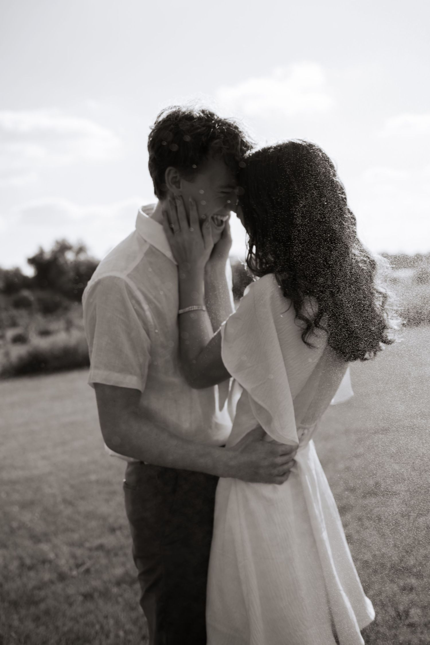 Emotional black and white series capturing intimate moments between couple outdoors.