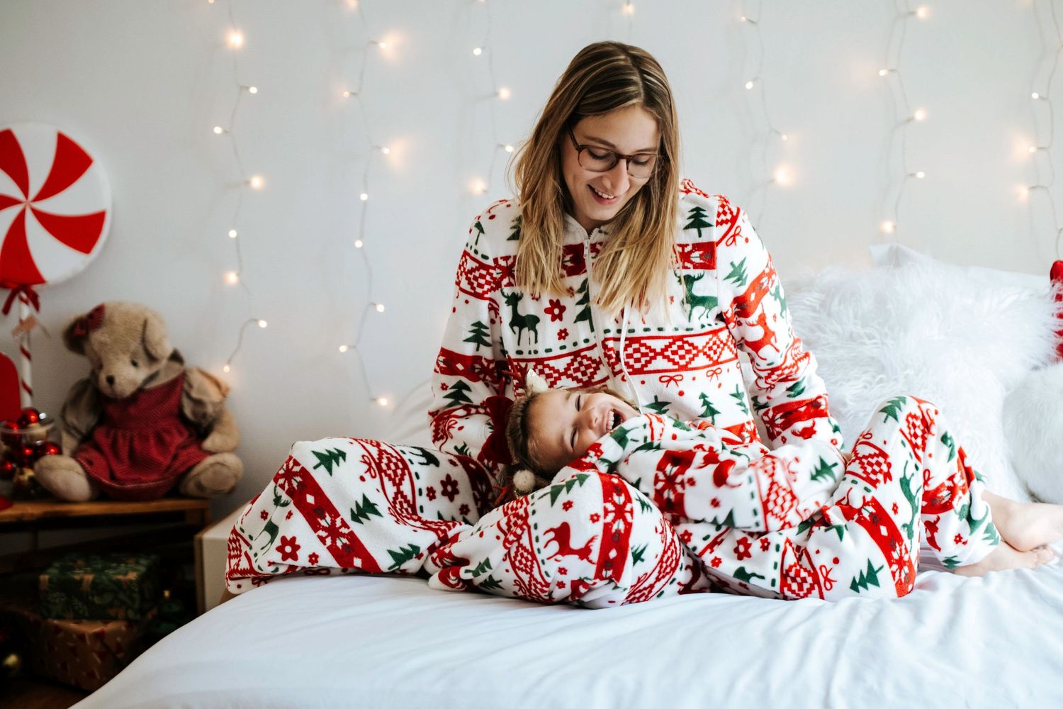 Holiday themed lifestyle photos with festive red and white decor and twinkling lights.