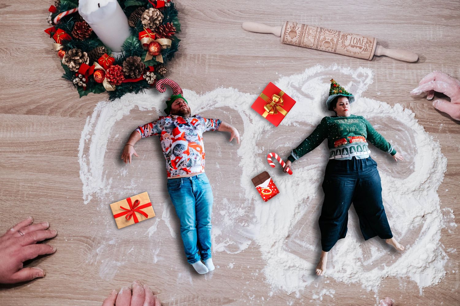 Stop motion sequence showing Christmas decorations and wrapping paper being arranged on wooden floor.