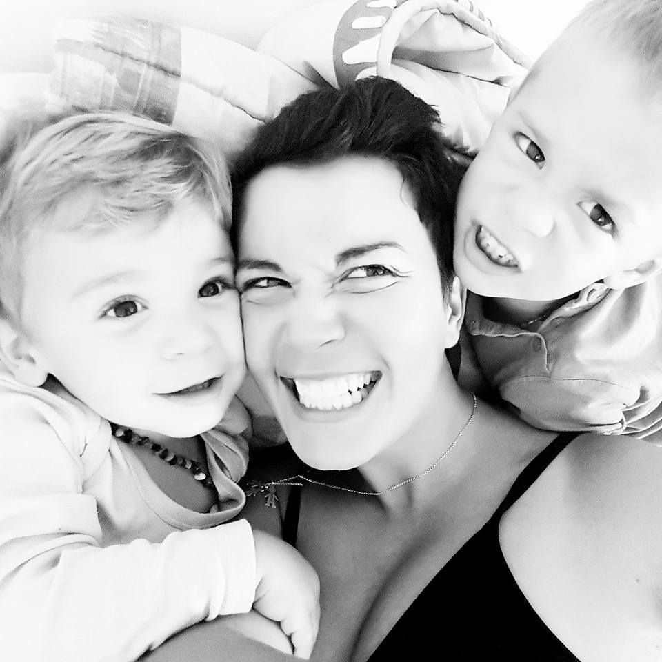 Black and white collage of candid close-up portraits showing joyful expressions and smiles.