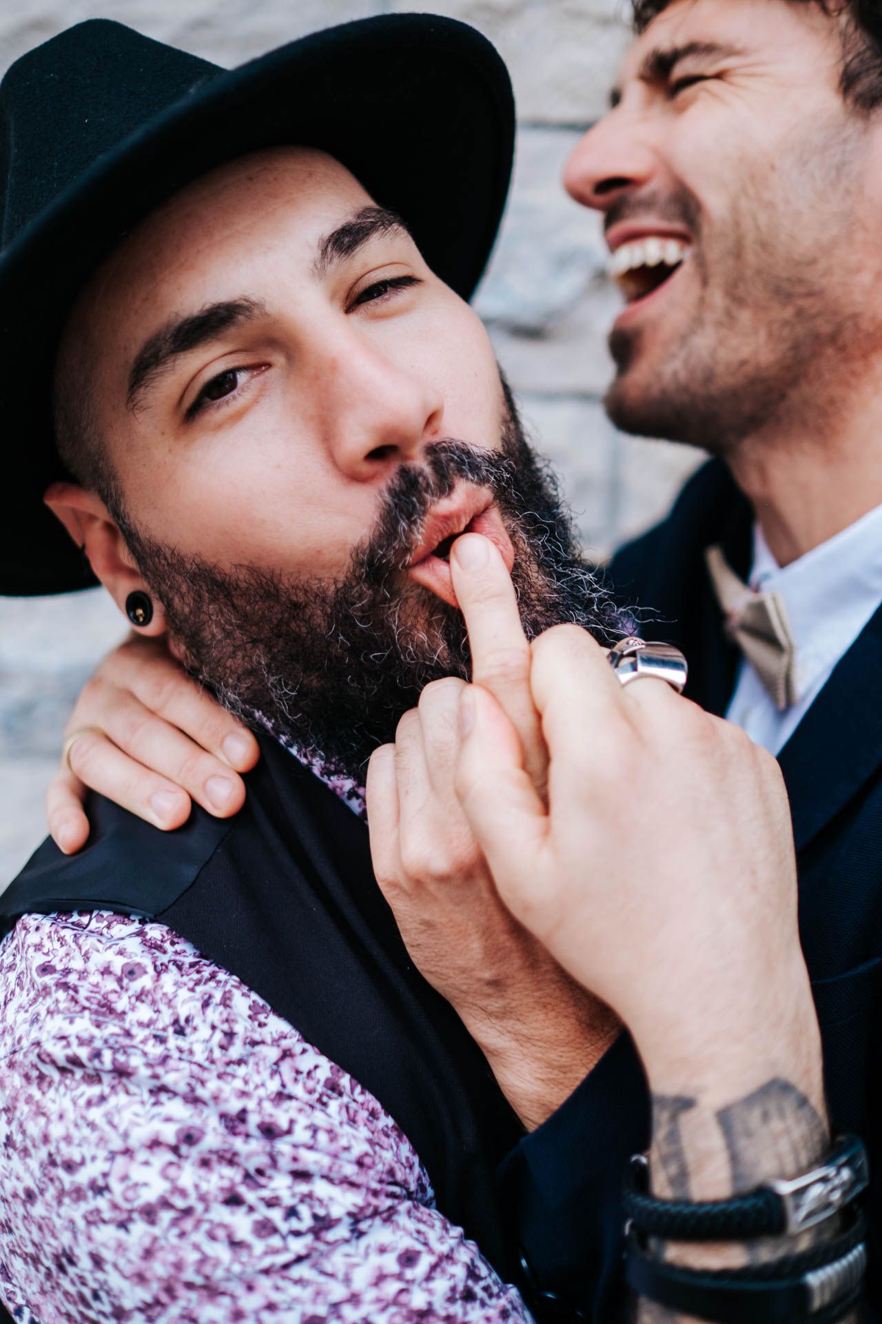 Close-up shots of guests sharing intimate moments at a wedding celebration.