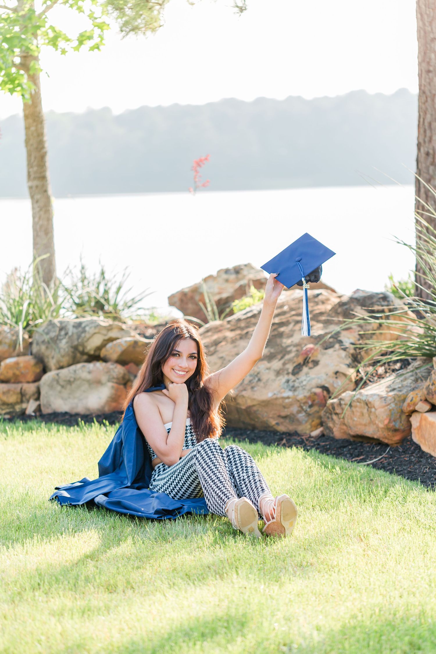 grad sitting on ground