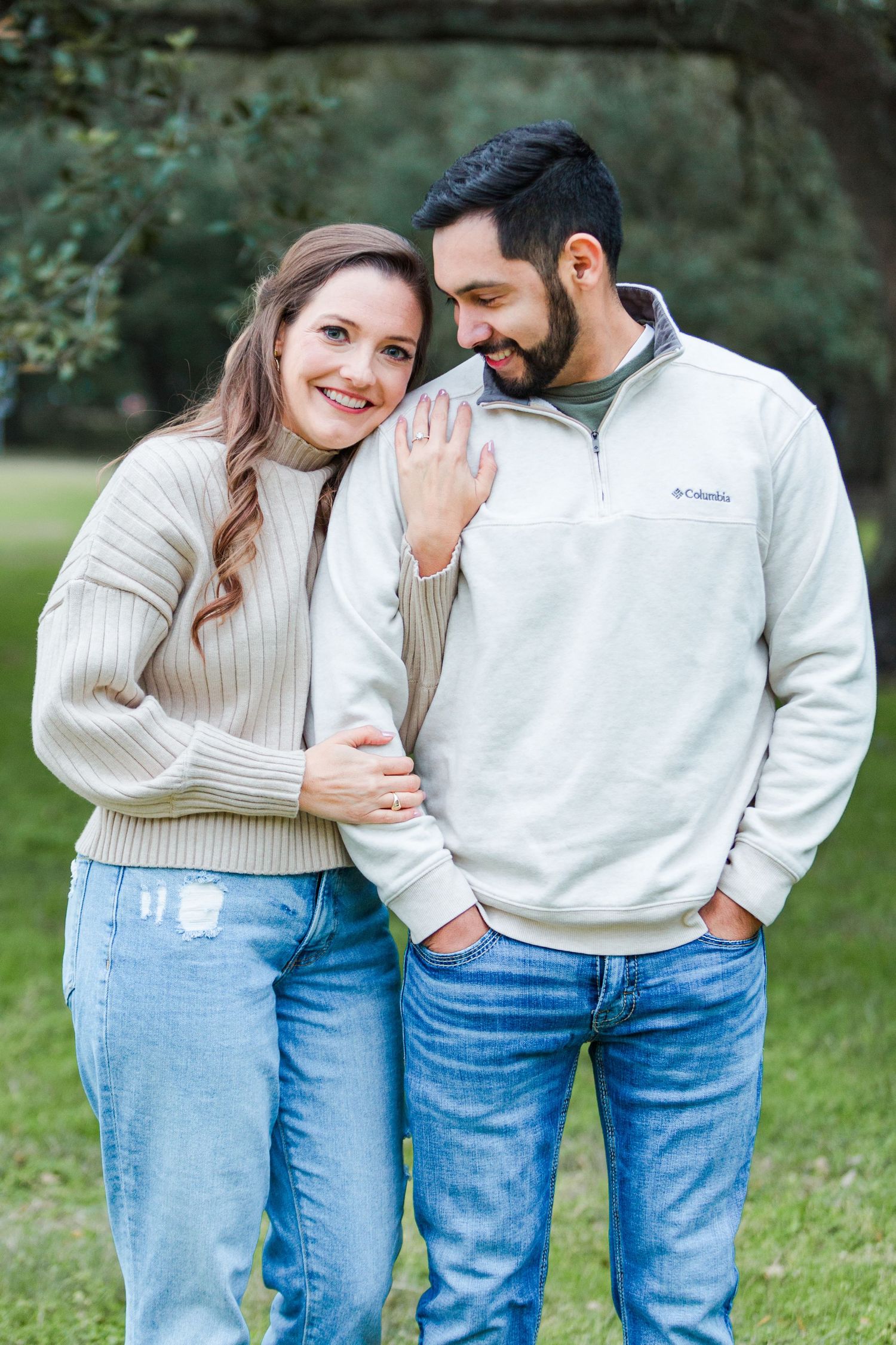 Intimate couple moment captured in casual outdoor setting.