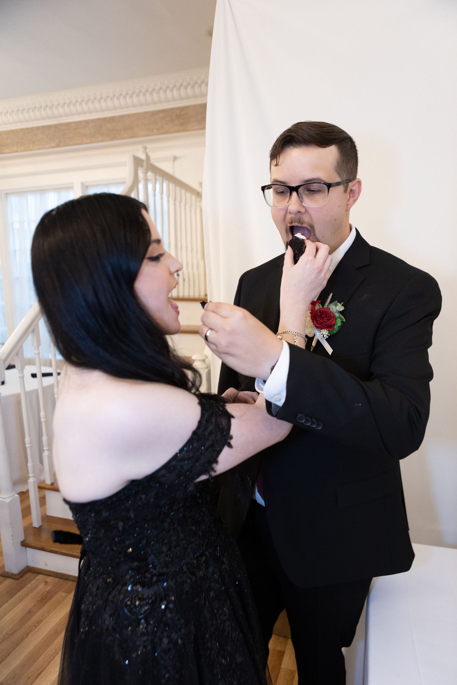 A sequence of photos showing a couple sharing a playful cake-smashing moment at a wedding celebration.