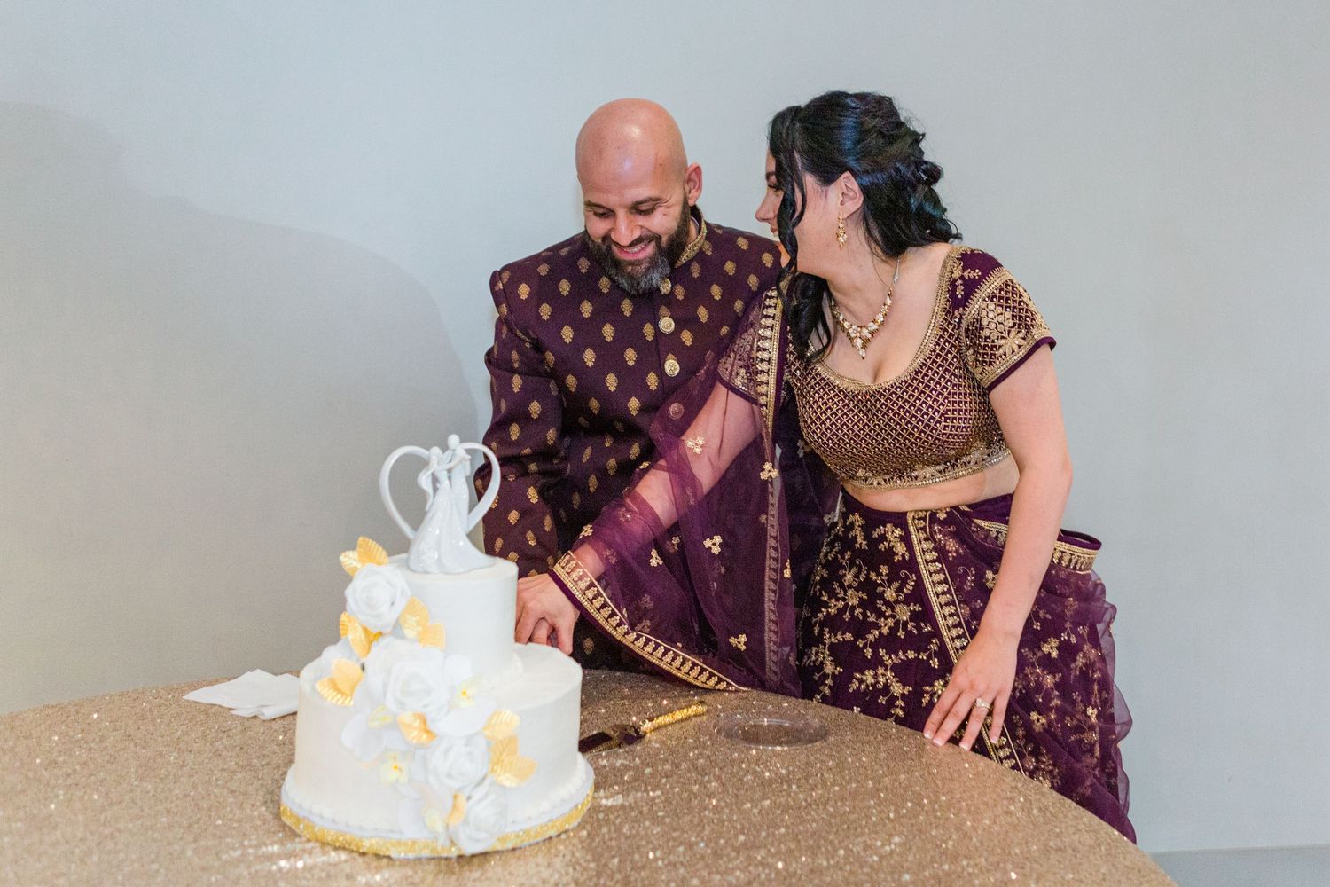 bride and groom cutting cake