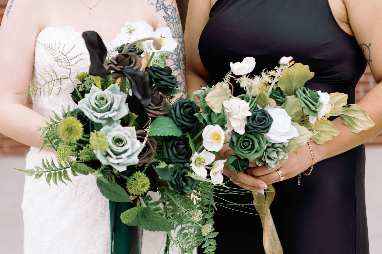 Wedding party members hold elegant bouquets featuring white and green flowers with eucalyptus leaves.
