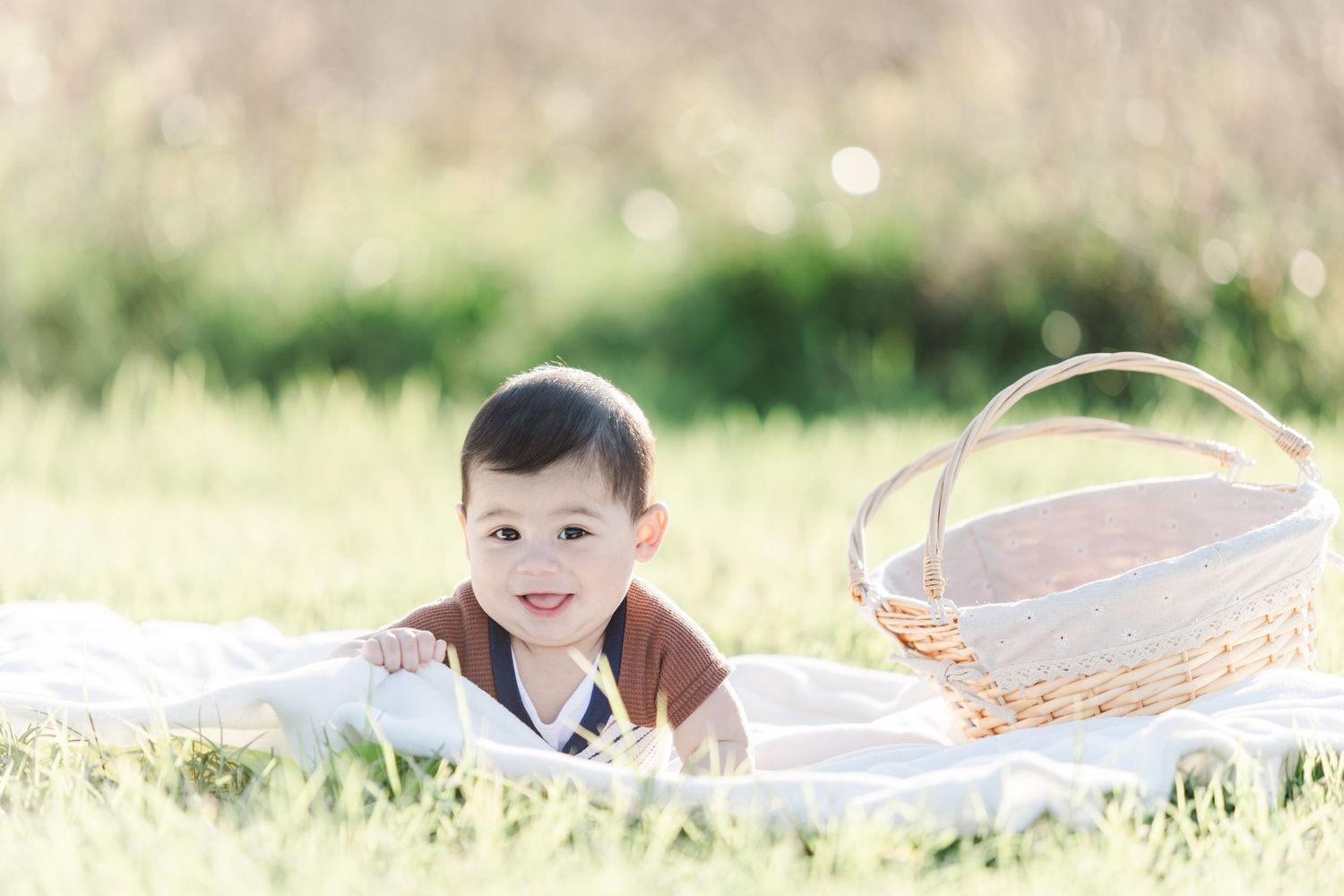 Candid portrait series in a sunny field with soft natural lighting.