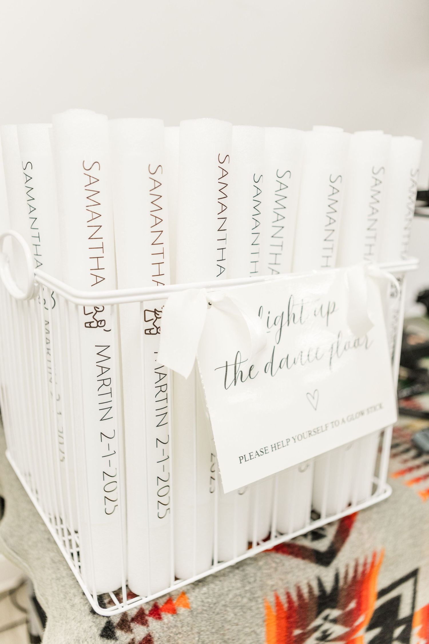 Collection of white wedding favor boxes arranged in neat rows.