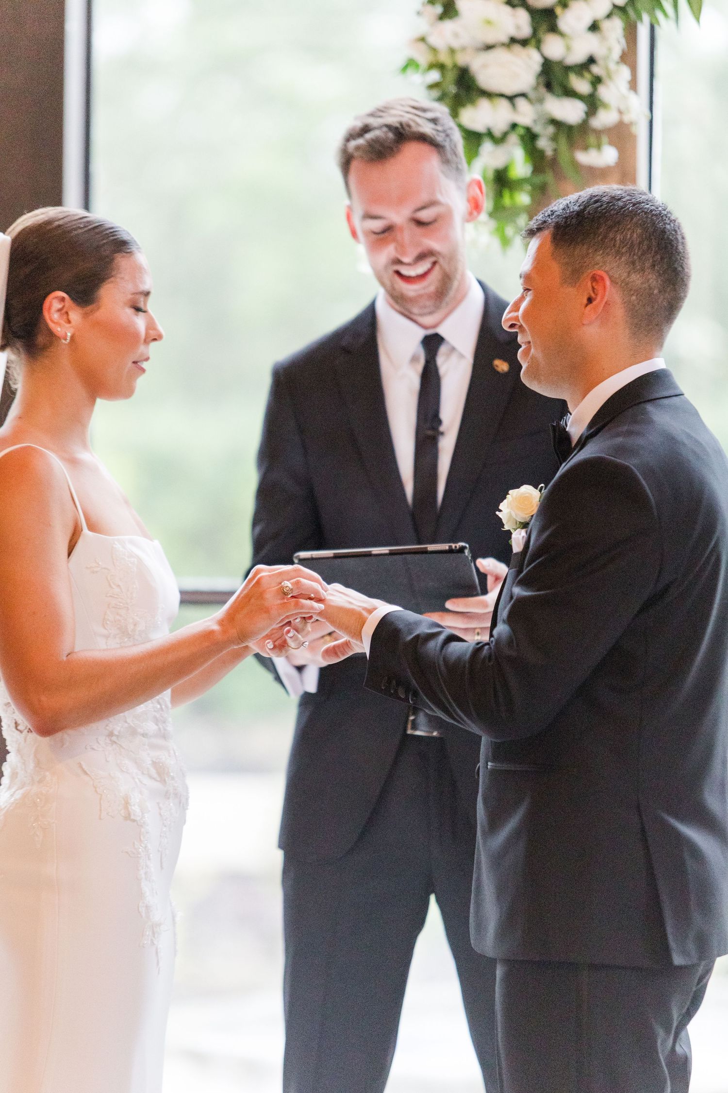 Wedding ceremony progression showing ring exchange and vows in an elegant indoor venue.