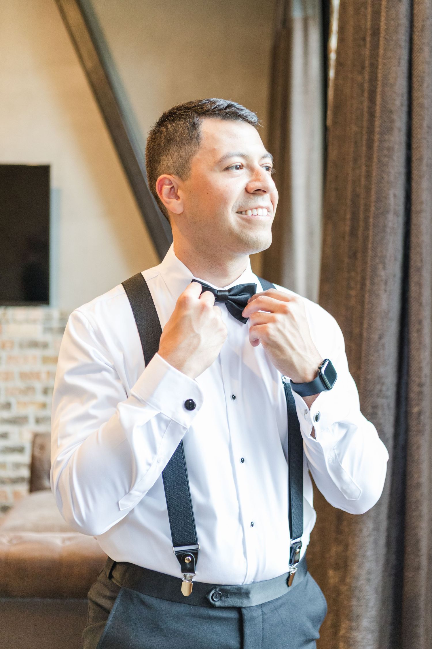 Wedding preparation sequence showing adjustment of bow tie and suspenders.