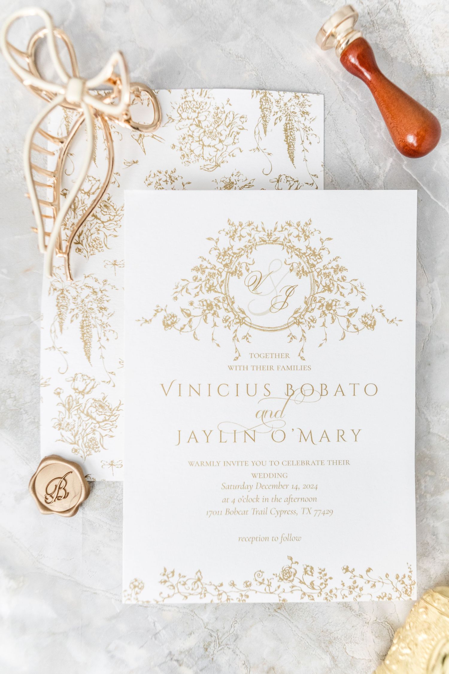 Luxury wedding invitations with gold floral designs and elegant typography on white paper.