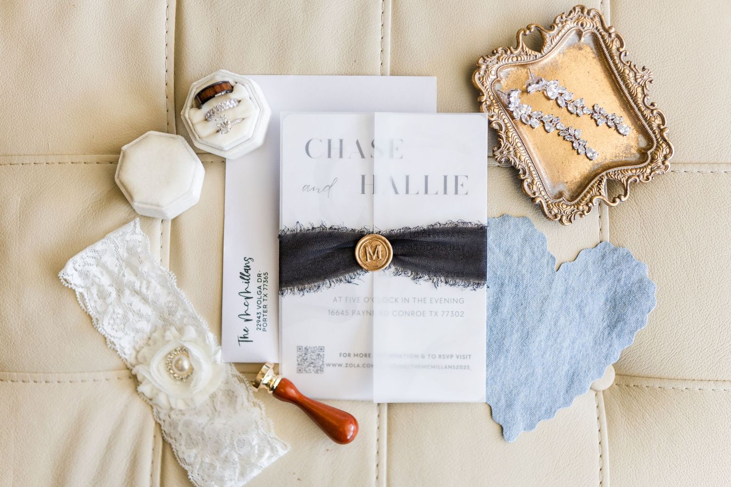 Flat lay of wedding invitations and decorative elements in neutral tones.