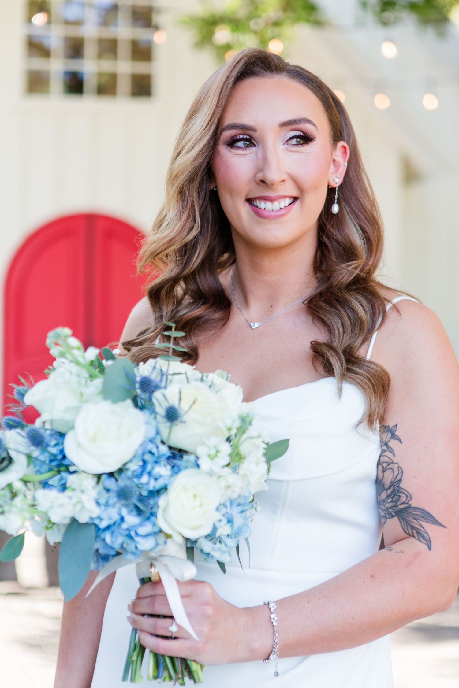 Wedding photography featuring elegant bouquet with blue and white flowers.