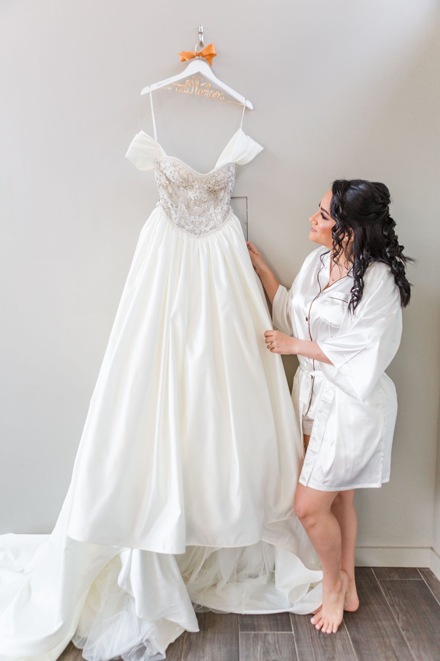 bride looking at her dress