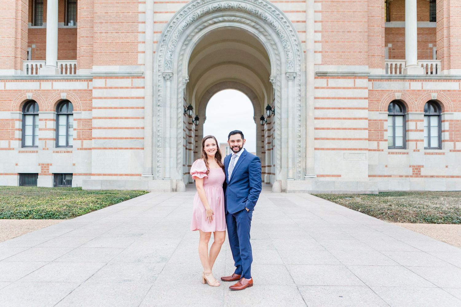 A romantic moment captured between two people at UCLA's iconic Royce Hall entrance.