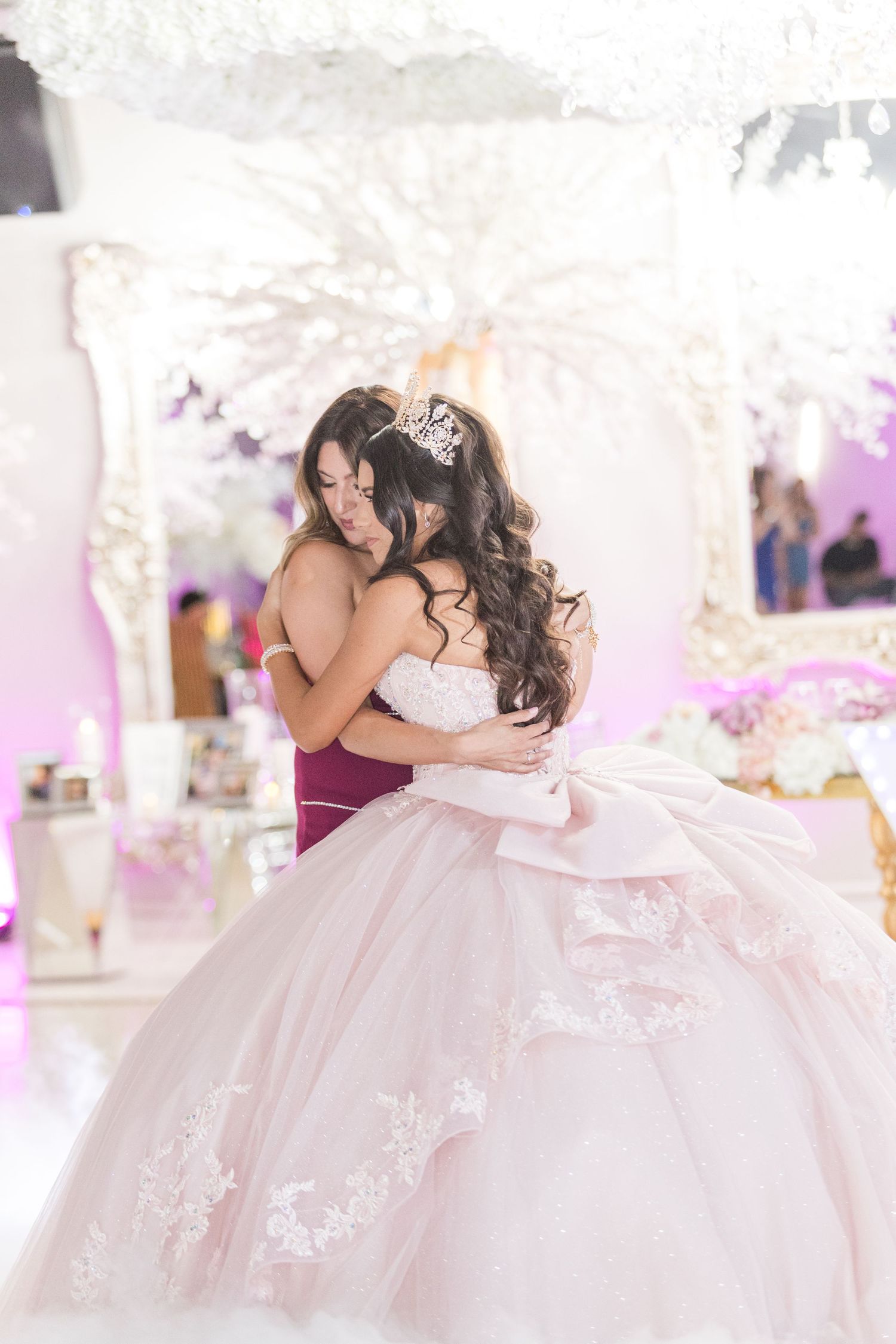 Graceful movement of a white ball gown captured in a beautifully lit reception venue.
