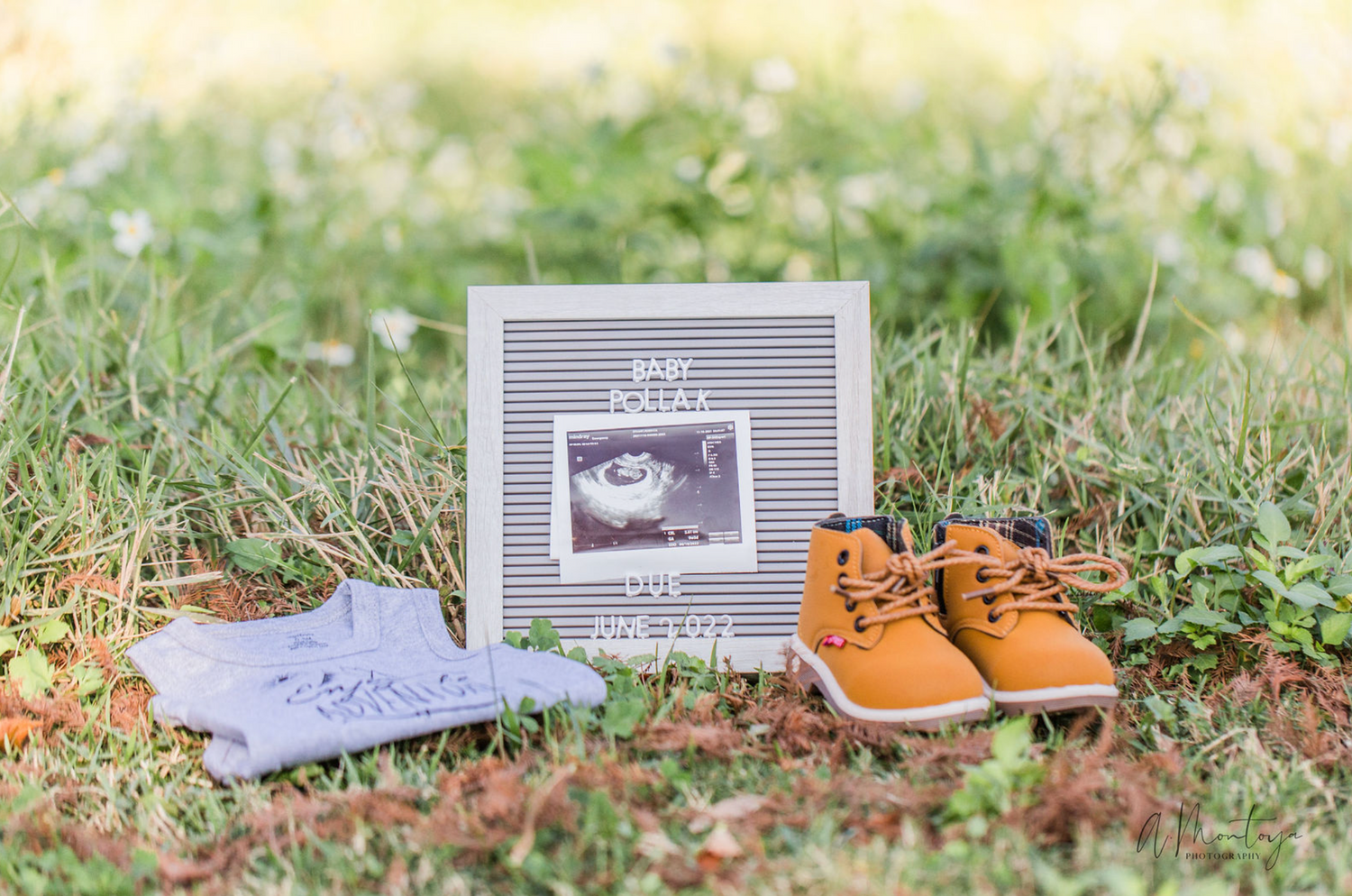 Shoes and props arranged on autumn leaves with small signs in an outdoor setting.