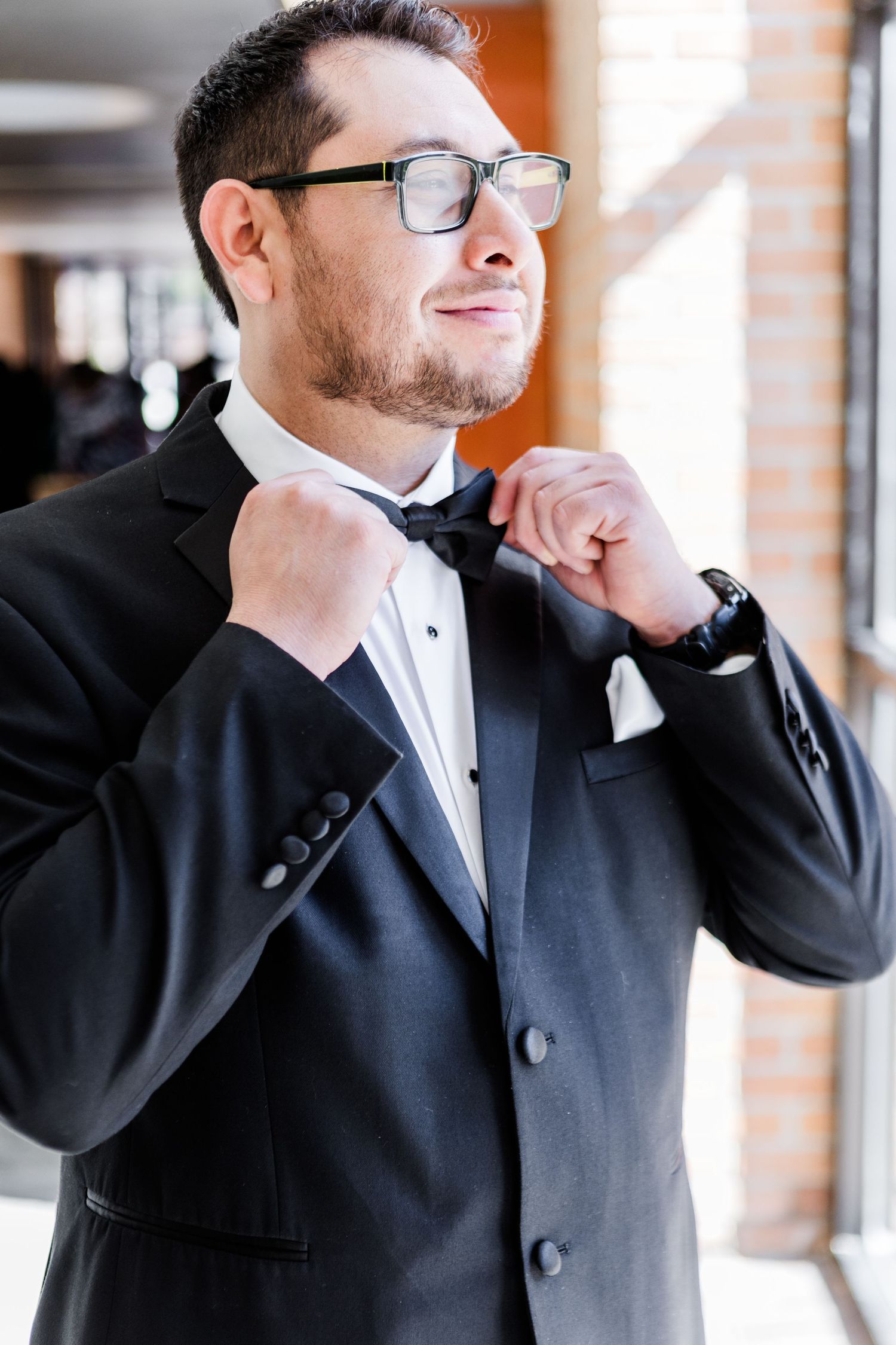 Close-up shots showing formal attire and adjusting of clothing.