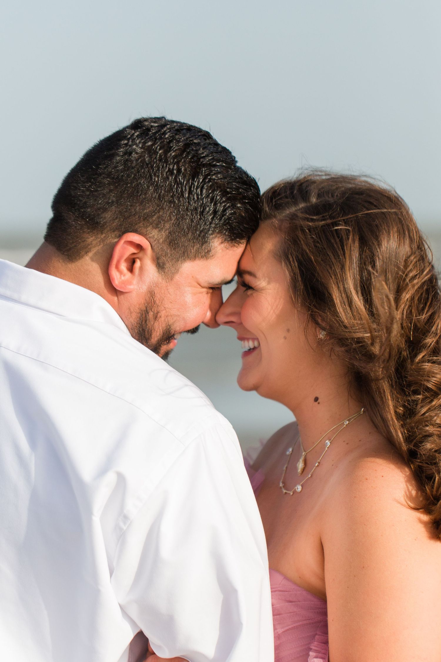Close-up shots of a couple sharing intimate moments against a light background.