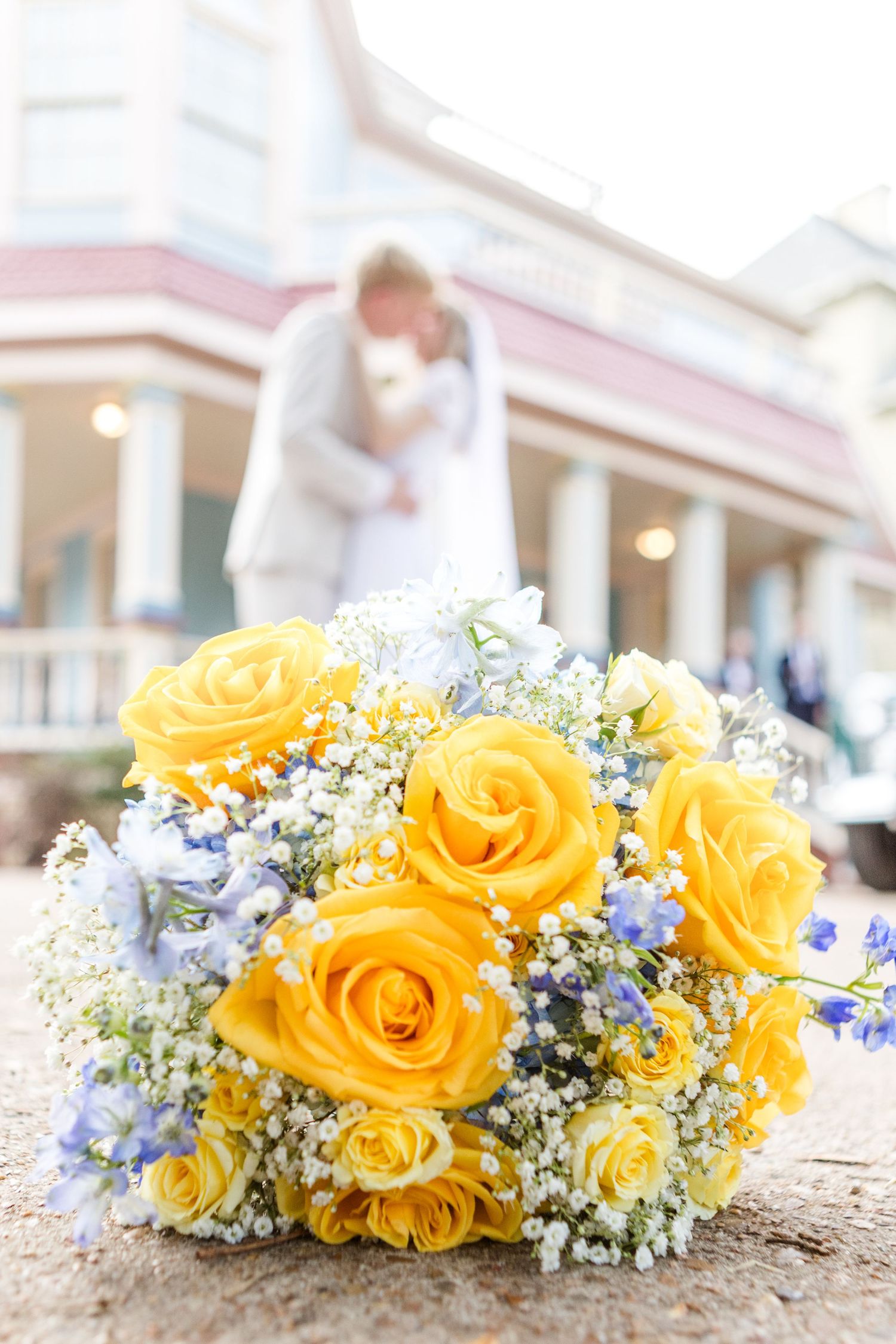 Yellow roses and baby's breath wedding bouquet arranged in a series of detail shots.