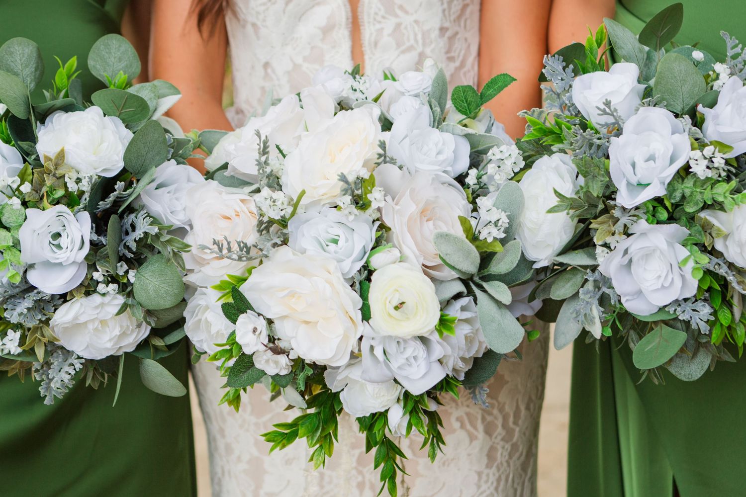 Elegant white floral bouquets with eucalyptus arranged in a horizontal display.