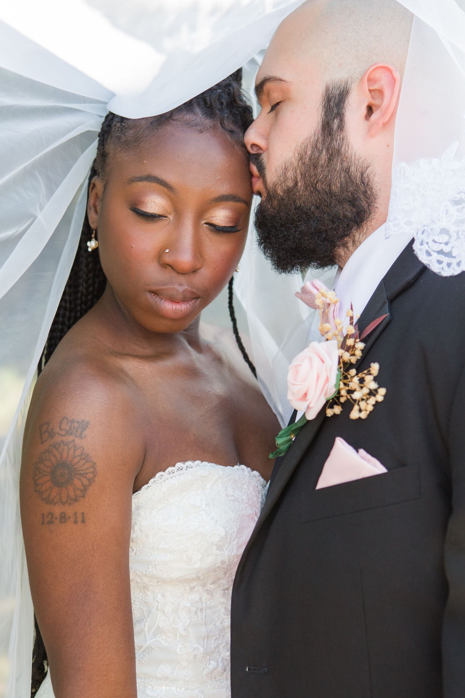 Close-up wedding portraits showing tender moments through delicate lace veil details.