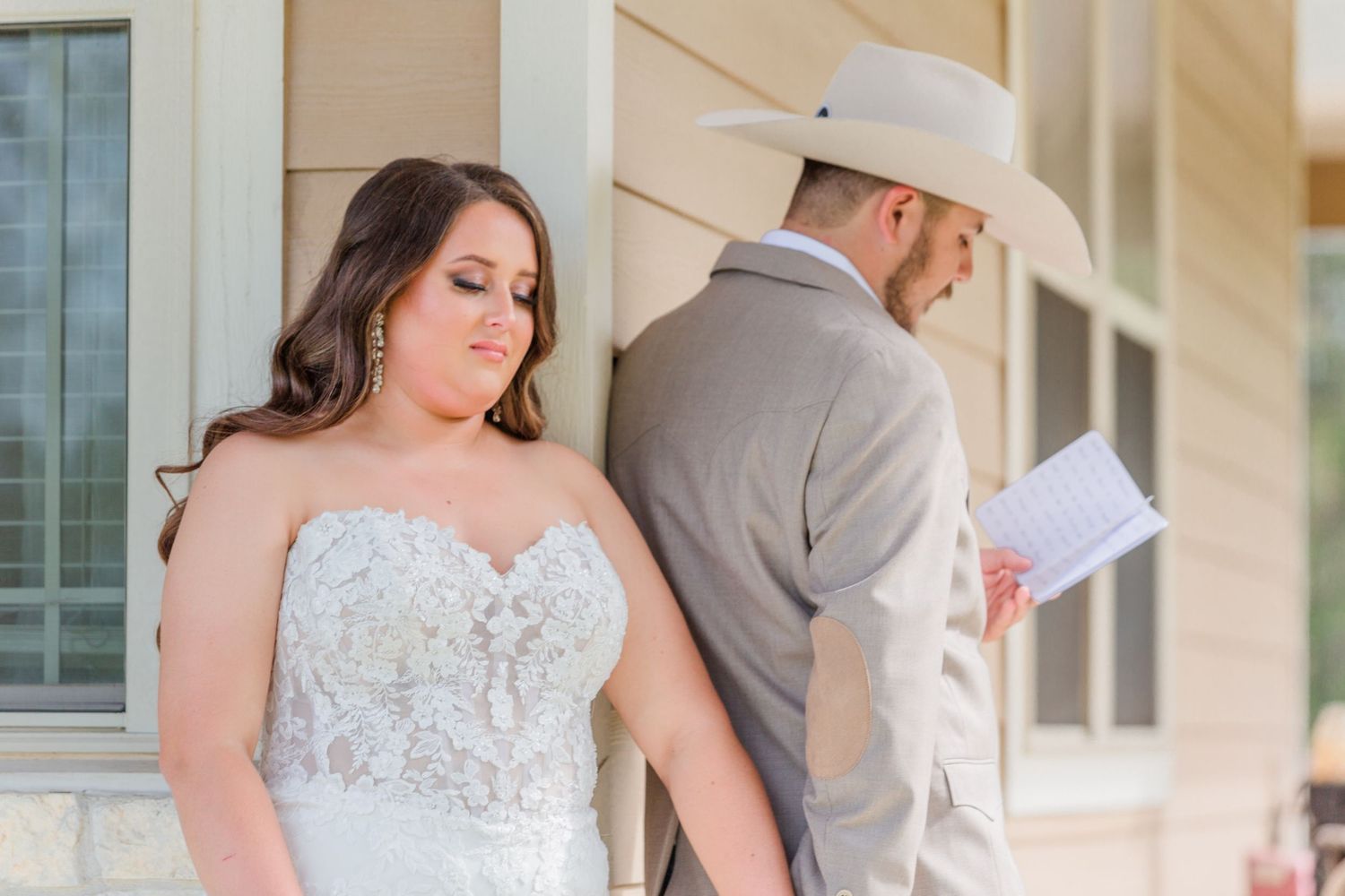 Soft sunlit wedding portraits showcase a bride in a detailed lace gown.