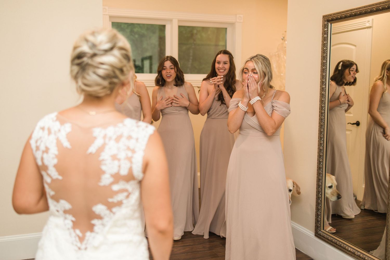 Bridesmaids in matching robes sharing excited moments before the wedding ceremony.