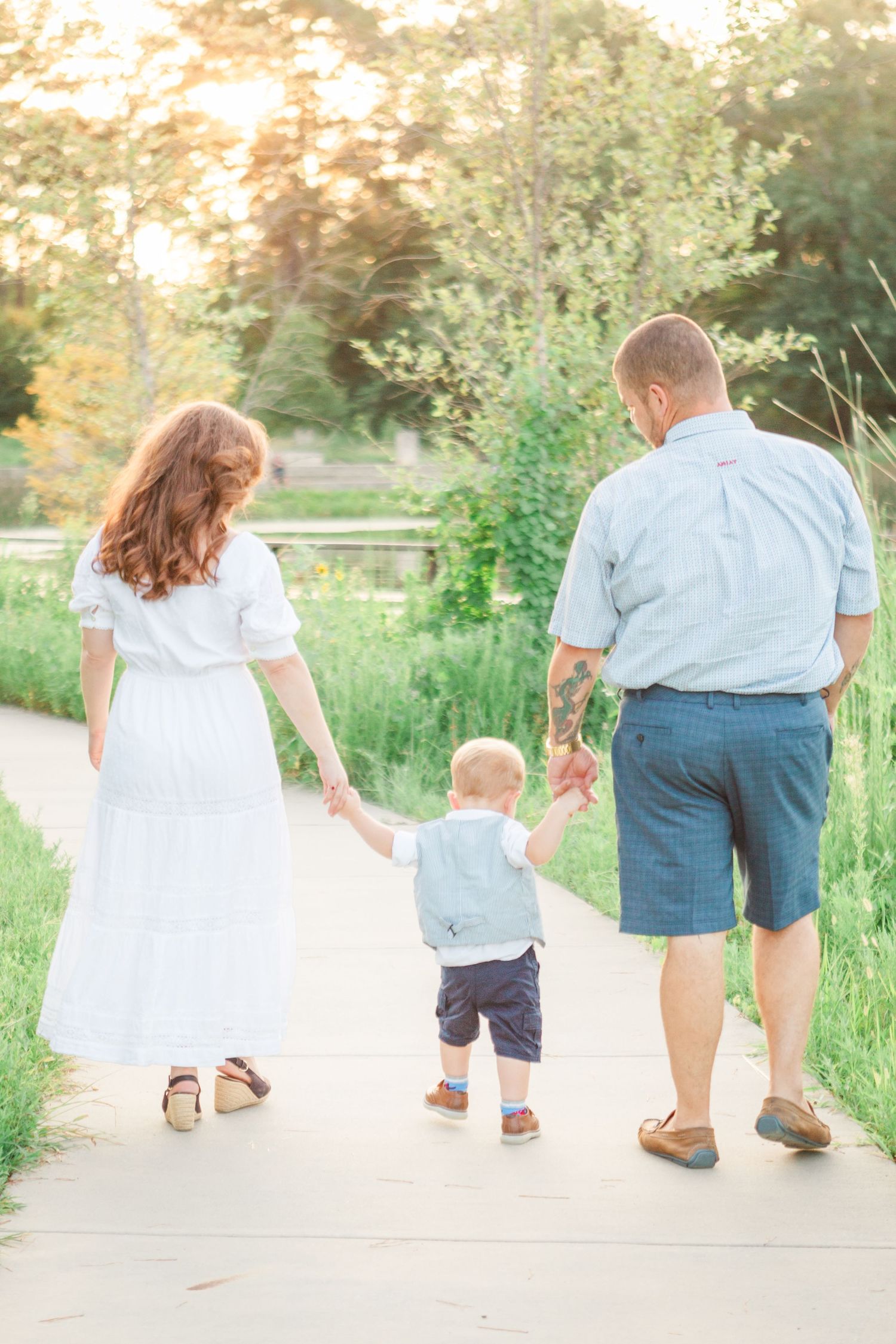 family walking golden light