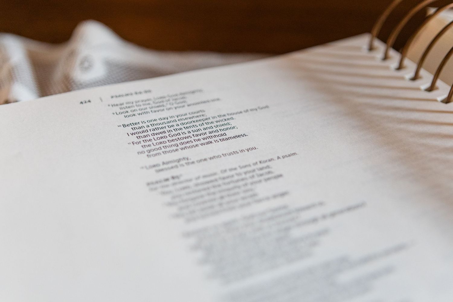 Close-up detail shot of wedding ceremony text on white paper.