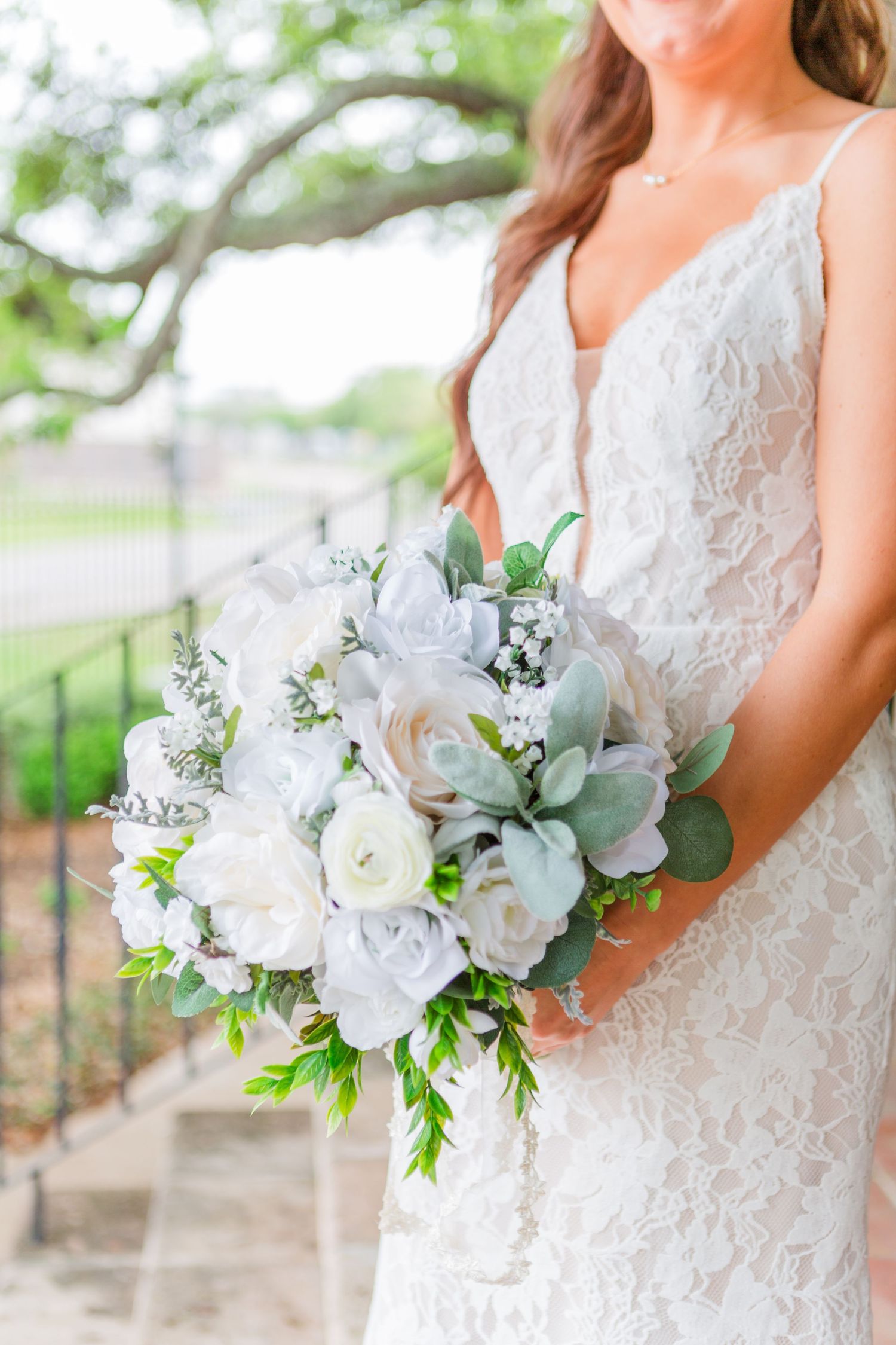 Beautiful white and sage green bridal bouquet with roses and eucalyptus.