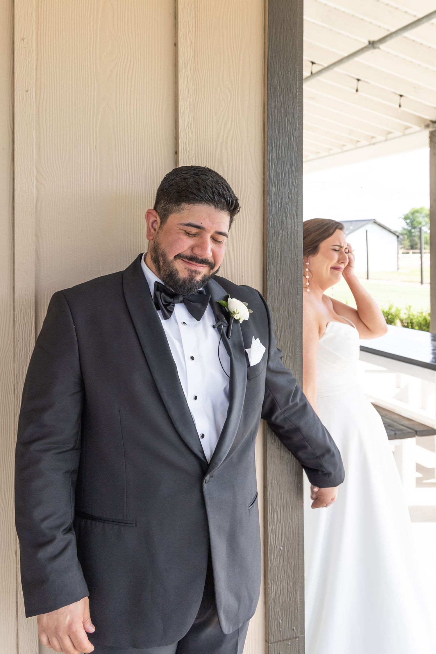 Couple shows emotional reactions during their first look photos.