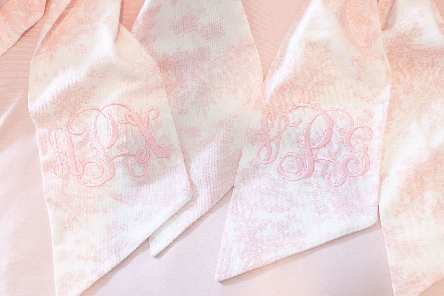 Pink and white abstract watercolor pattern with soft blended brushstrokes creates a dreamy gradient effect.