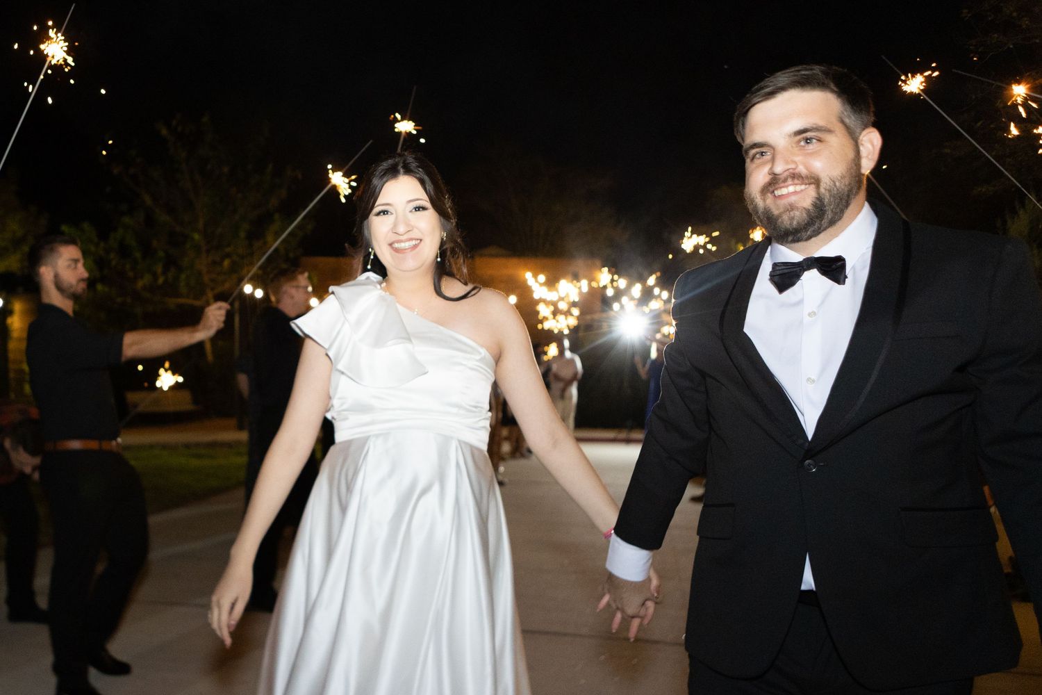 Evening wedding celebration with string lights creating a romantic ambiance.
