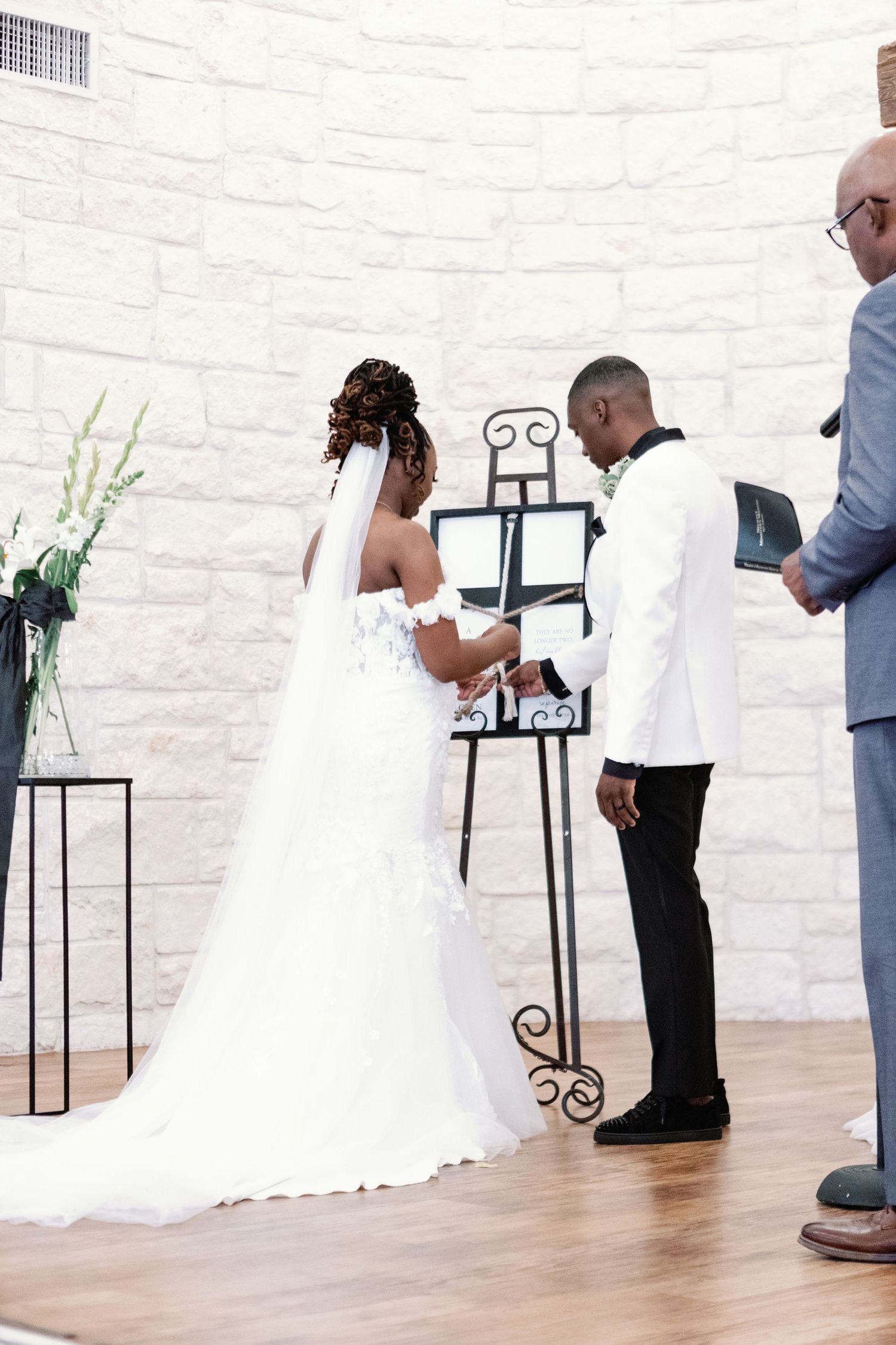 Wedding photo shoot sequence showing different poses in a white brick interior with light wooden floors.