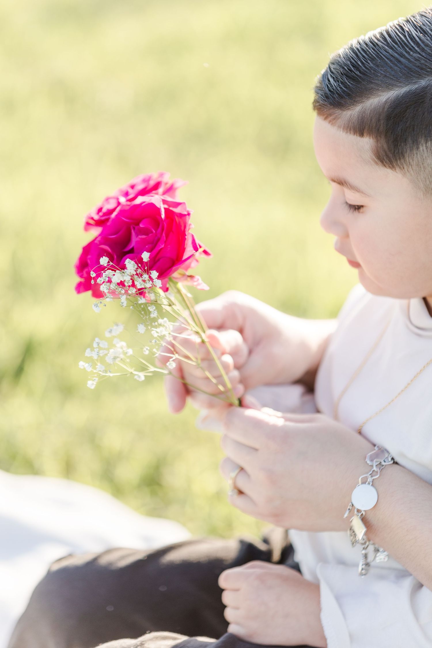 Close-up shots of pink flowers being held against a soft, natural background.