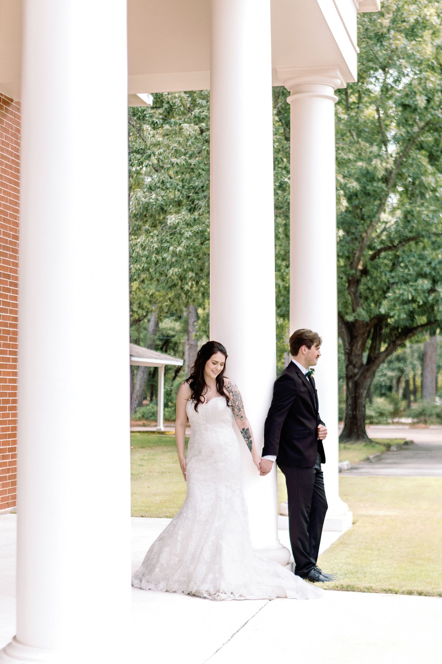 A romantic wedding photo sequence with a couple posing between classic white columns on a sunny day.
