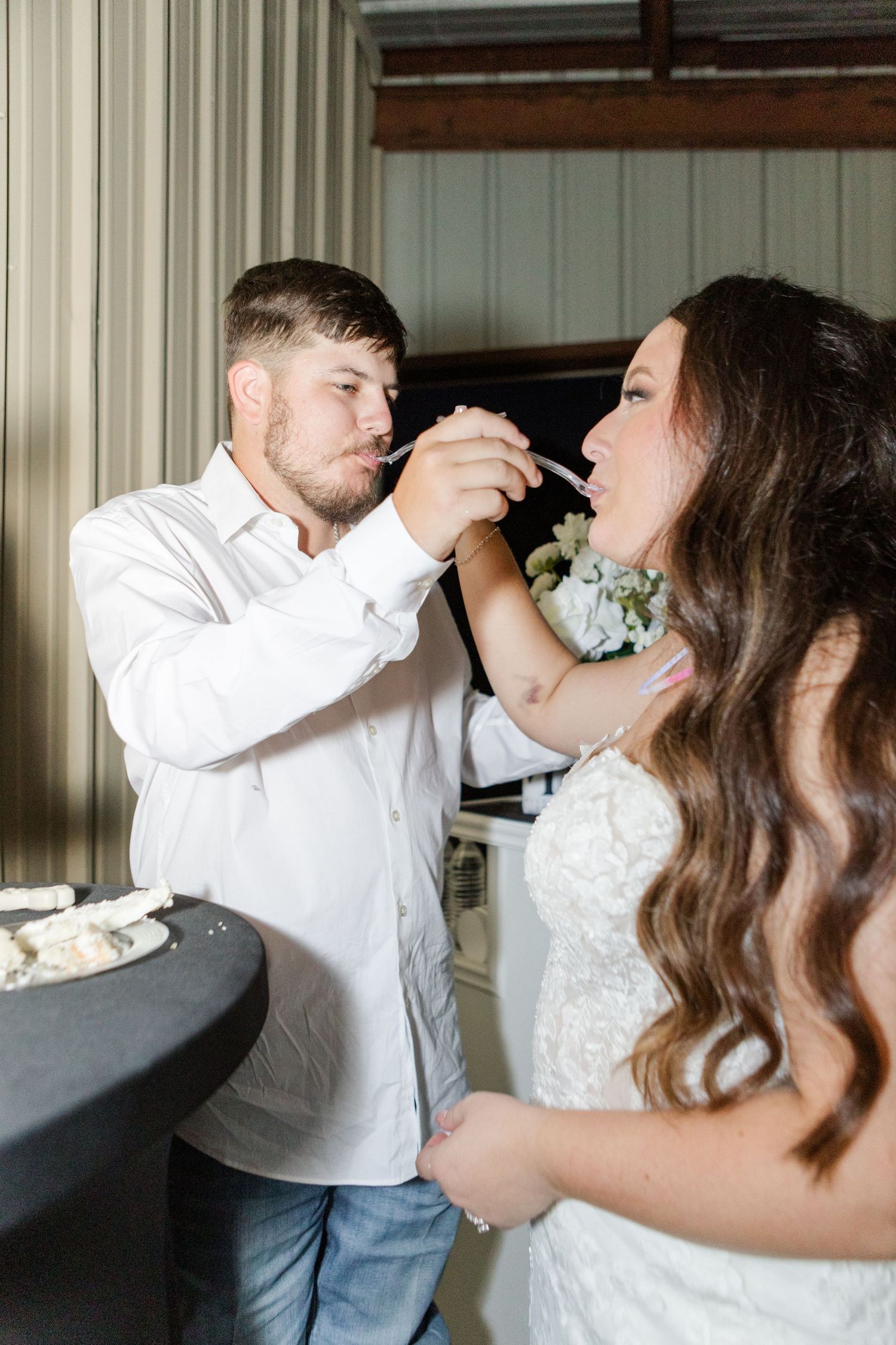 Series showing a couple sharing an intimate wedding day feeding cake moment.
