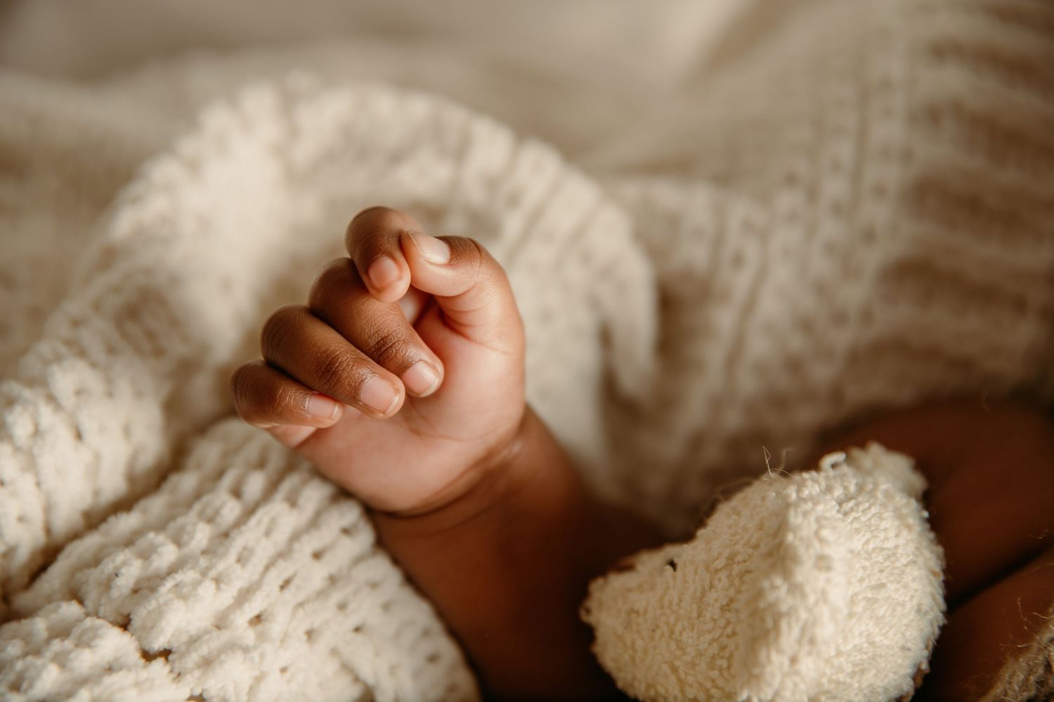 Close-up detail shot of newborn baby hand in photoshoot with Tami Harris Photography in Columbus area studio