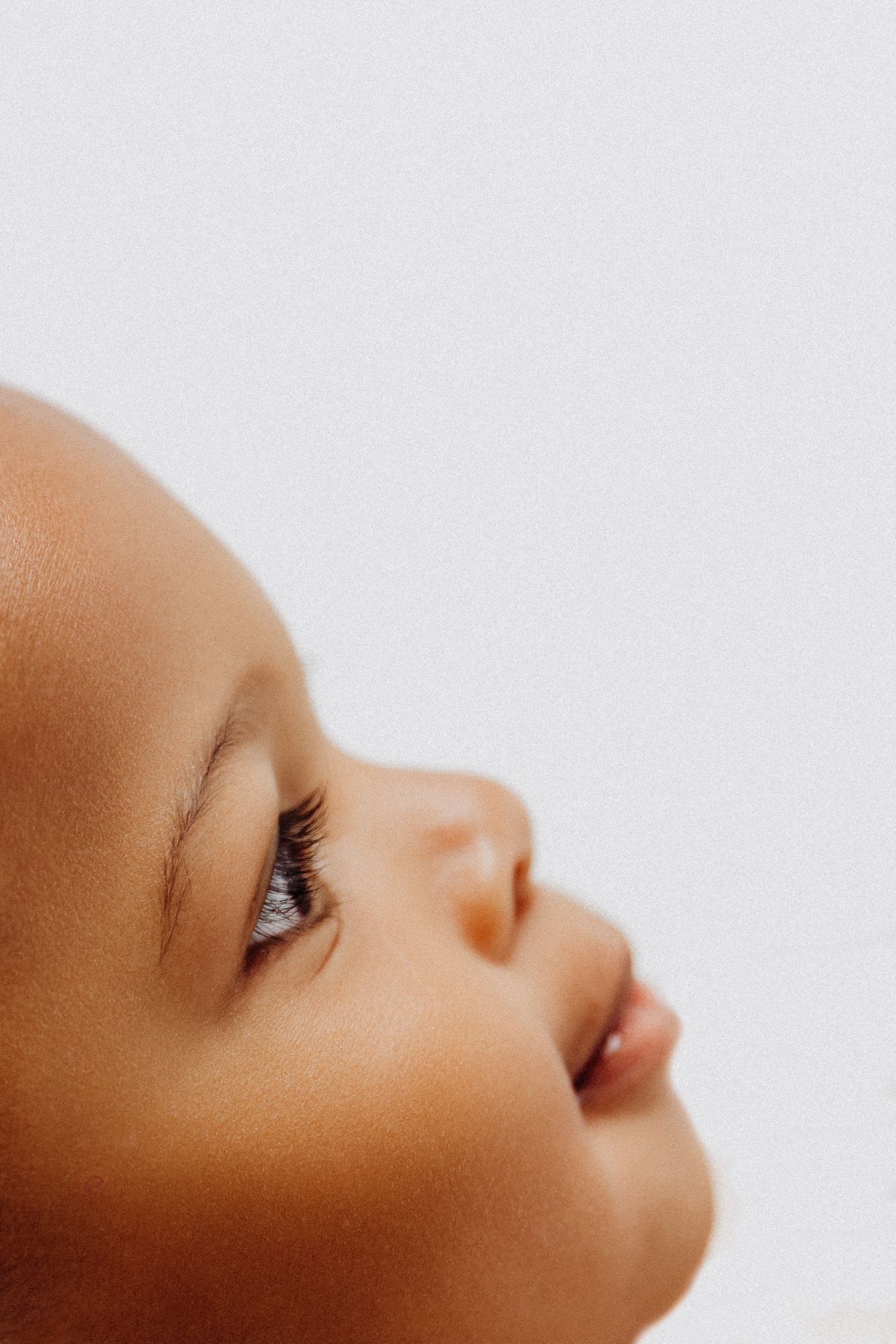 Close-up of smiling 1-year-old boy during Baby/Milestone 1st birthday photoshoot with Tami Harris Photography