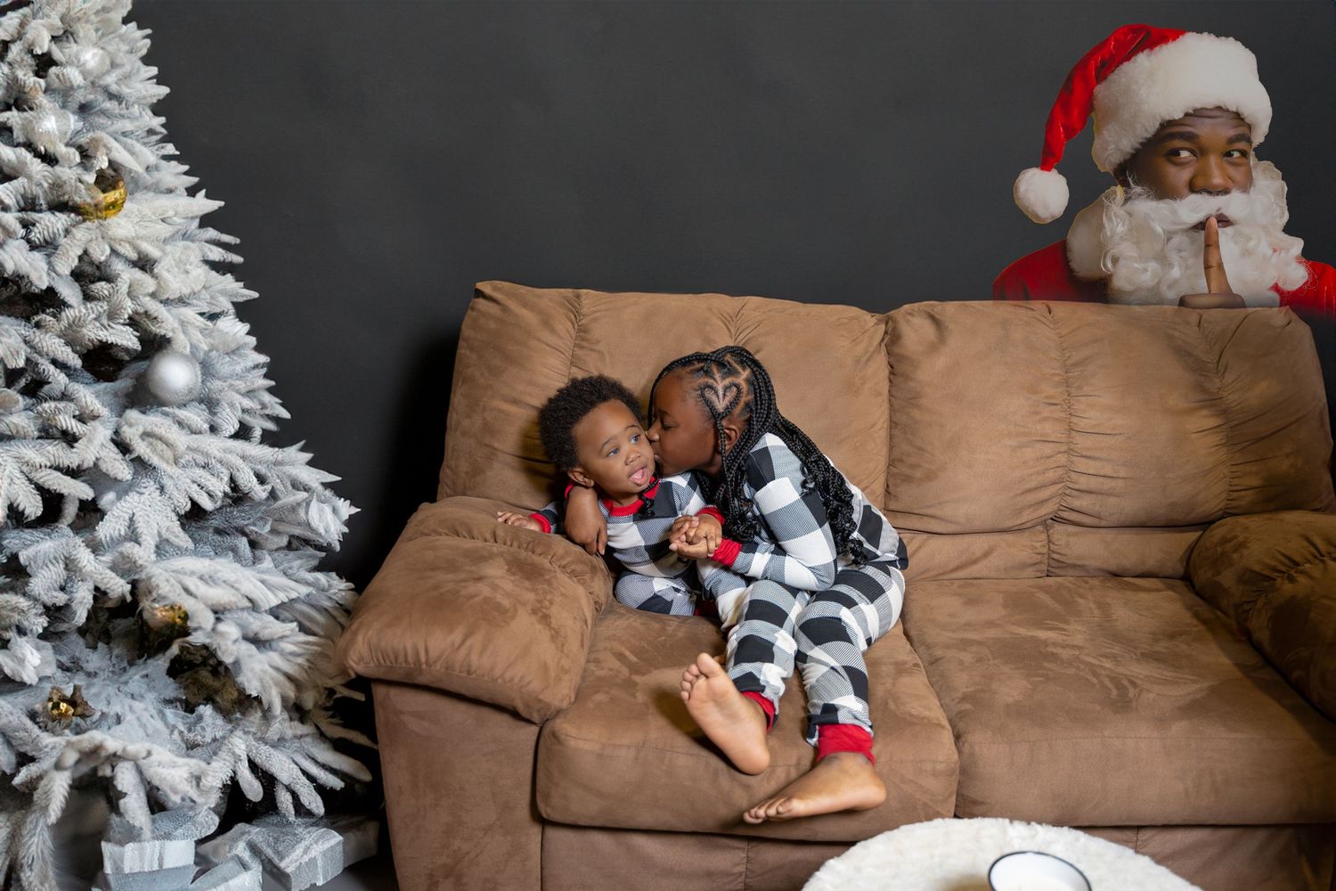 A festive Christmas scene with a cozy brown couch, white decorated trees, and holiday decor in a warm living room setting.