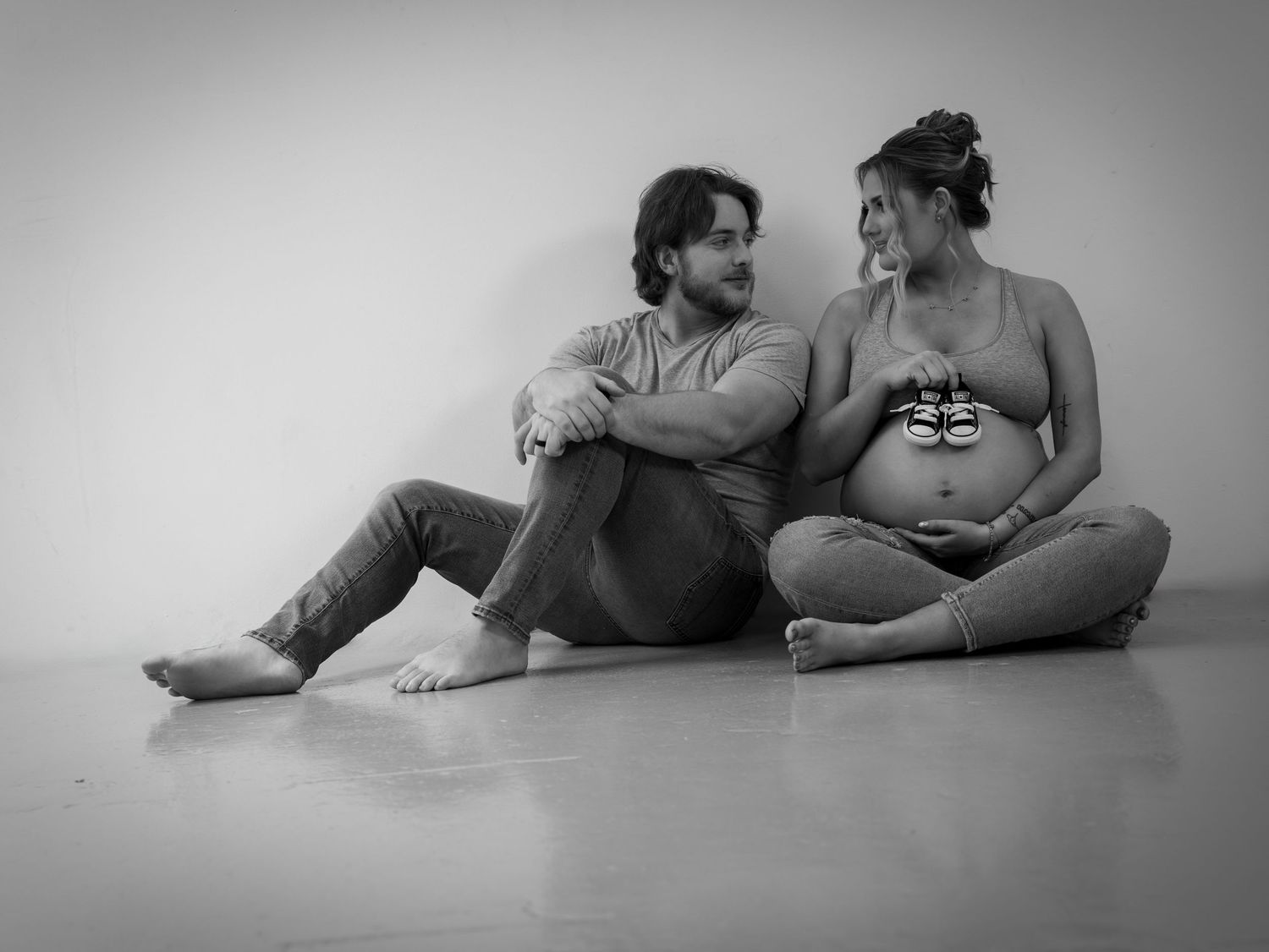 Intimate black and white photo series of two people laying together.
