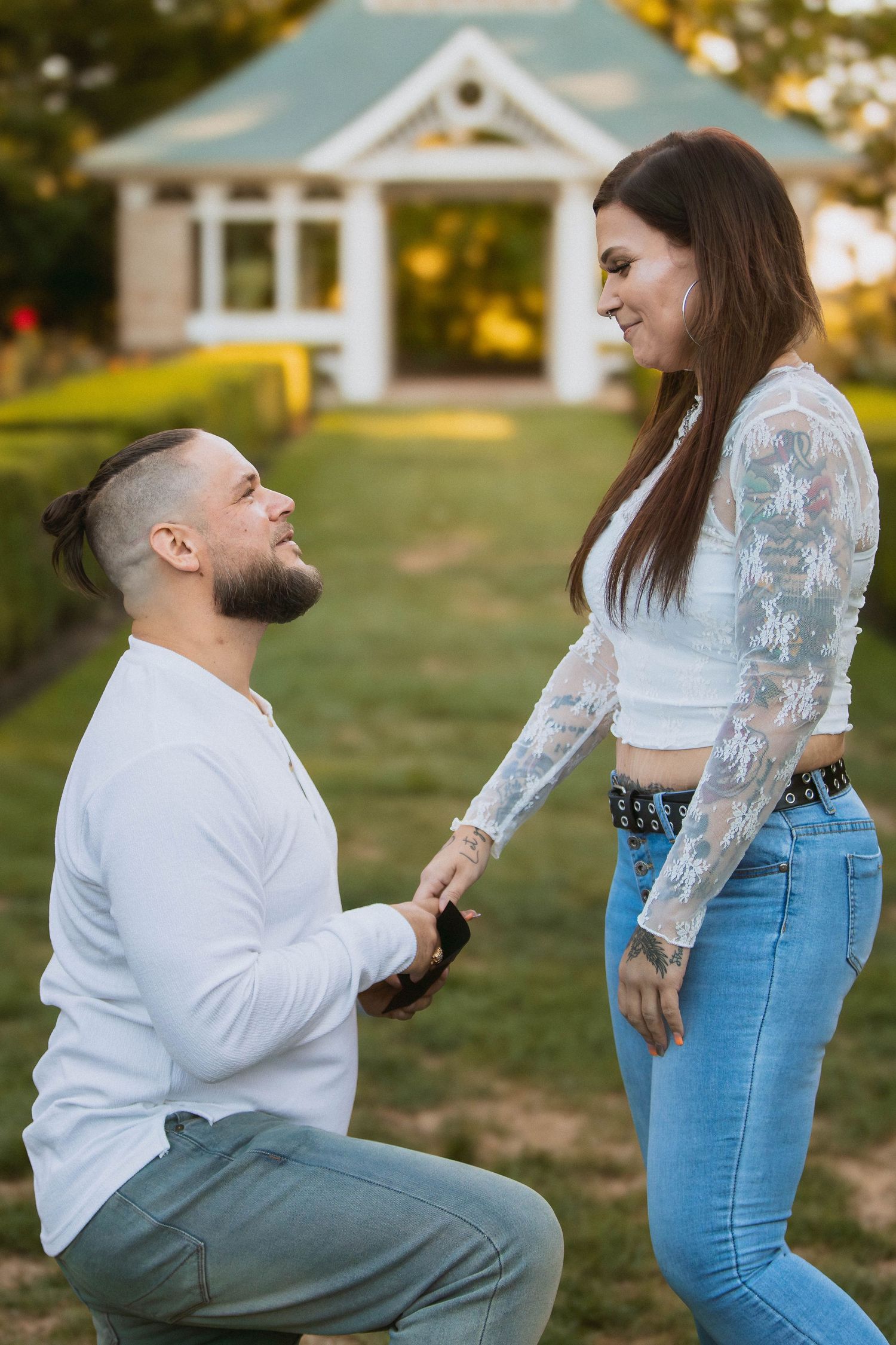 A series of photos showing a surprise outdoor marriage proposal between a couple in casual attire during golden hour in Youngstown, Ohio.