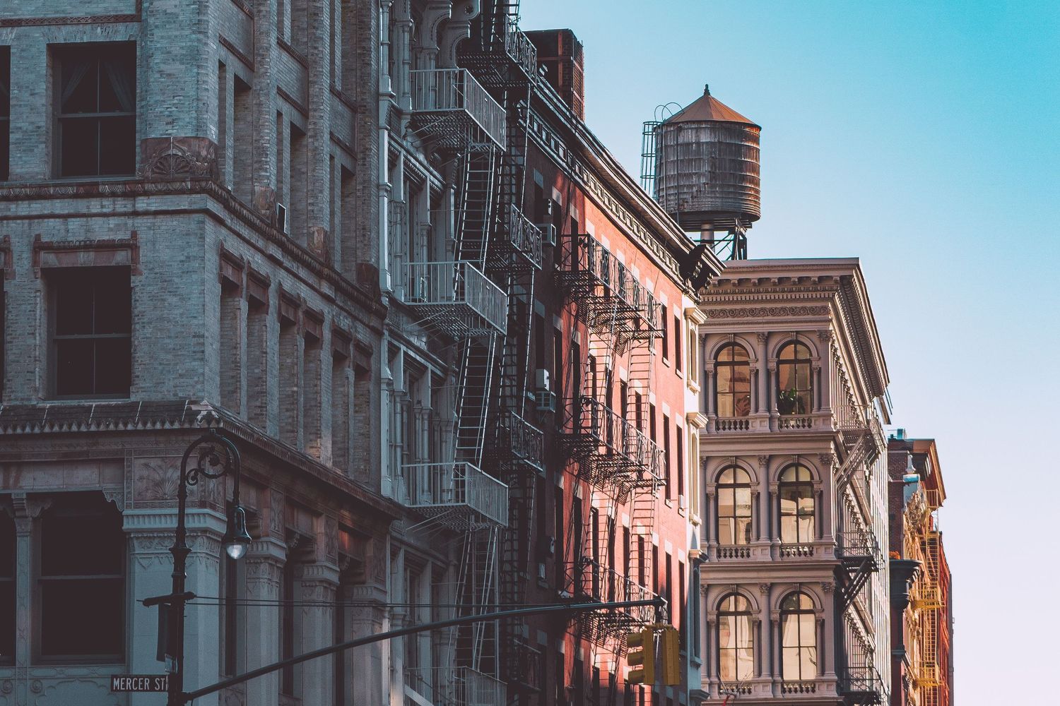 Historic architectural details of SoHo buildings with ornate facades and fire escapes.